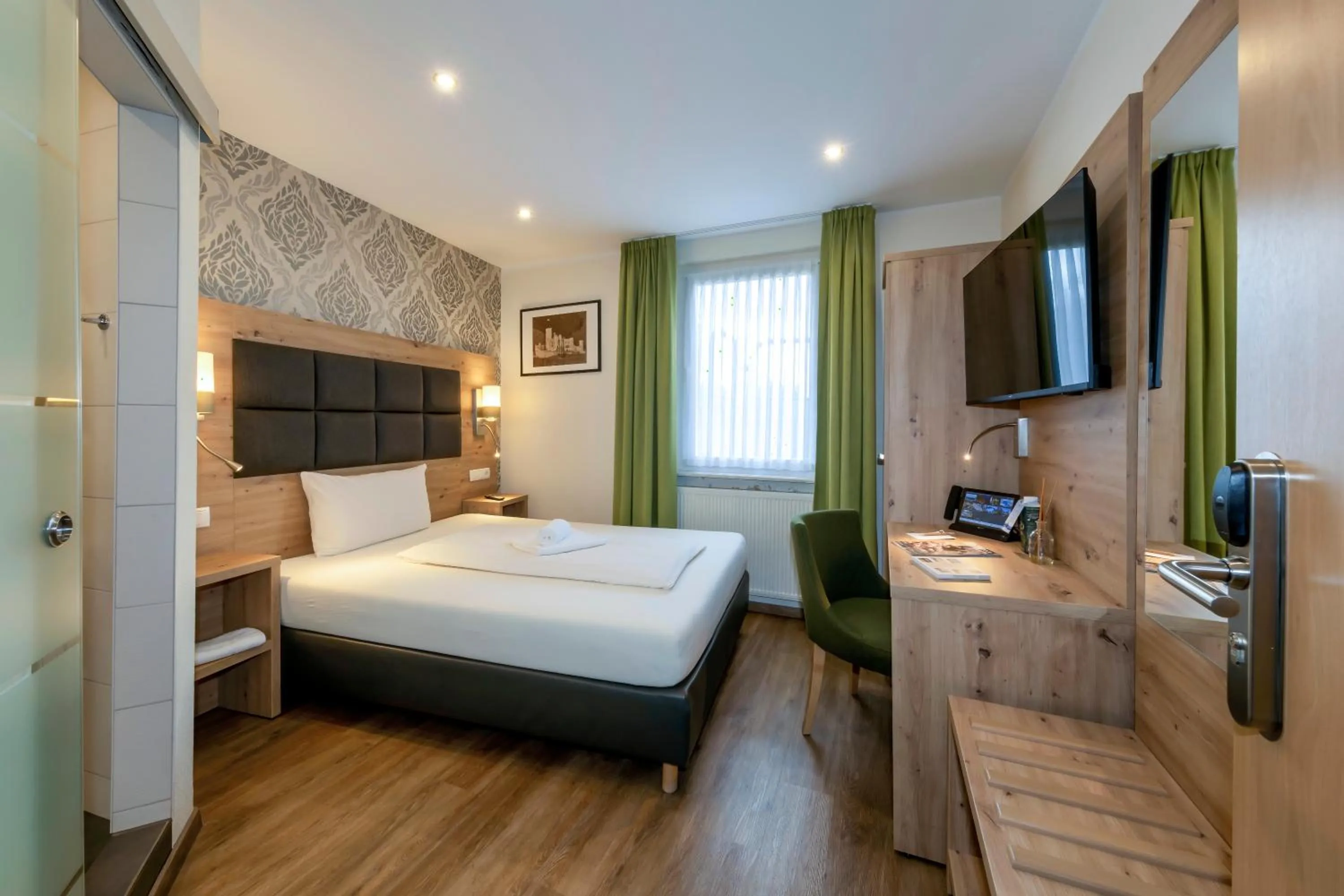 Bed in AKZENT Hotel Restaurant Roter Ochse Rhens bei Koblenz