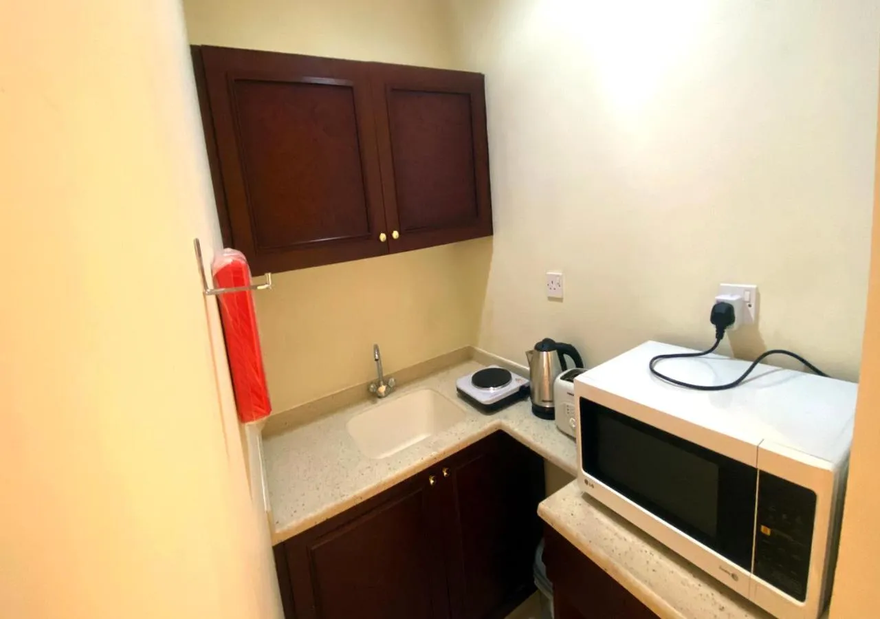 Kitchen or kitchenette in Majestic Hotel