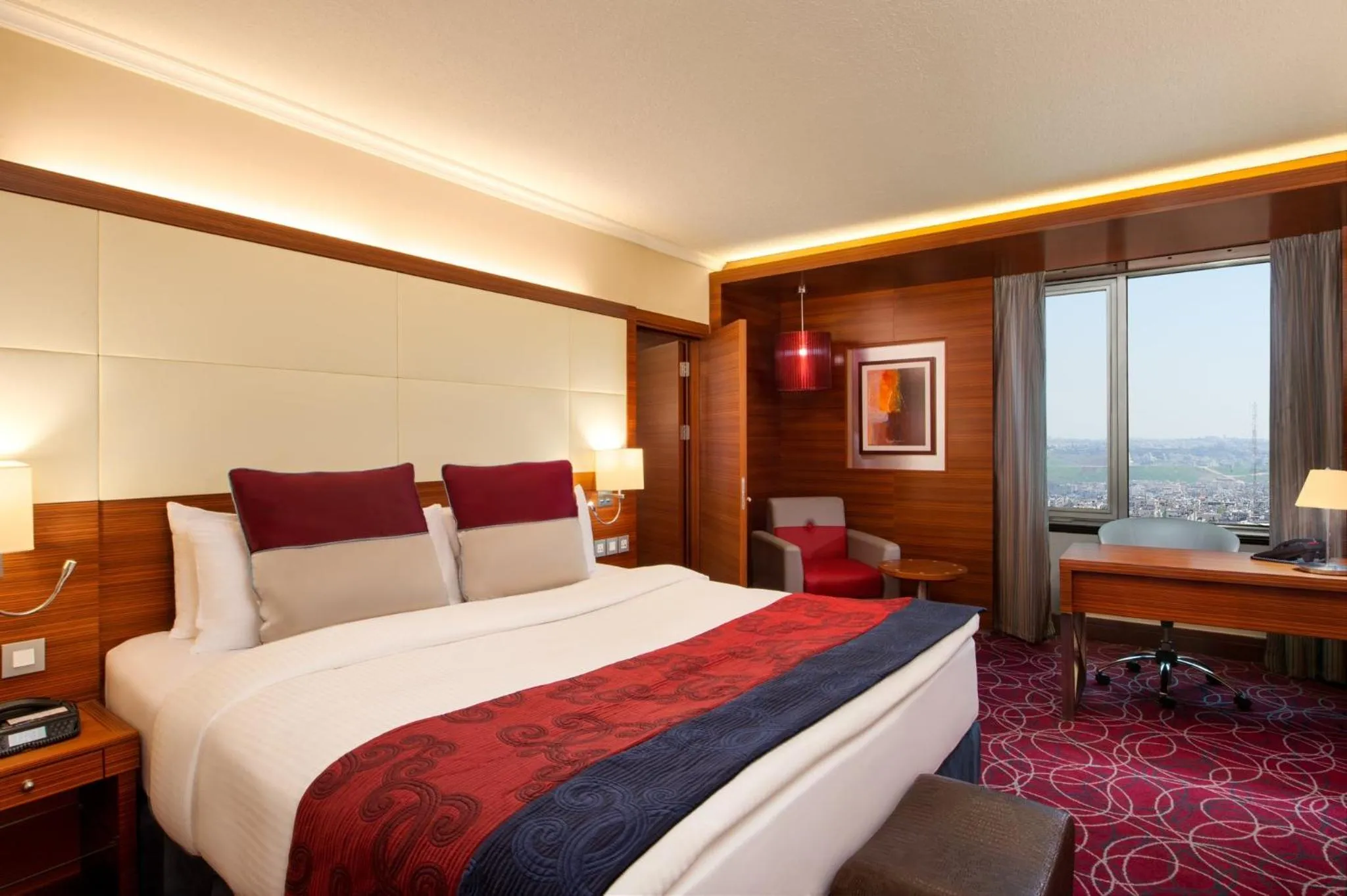 Photo of the whole room, Bed in Crowne Plaza Amman by IHG
