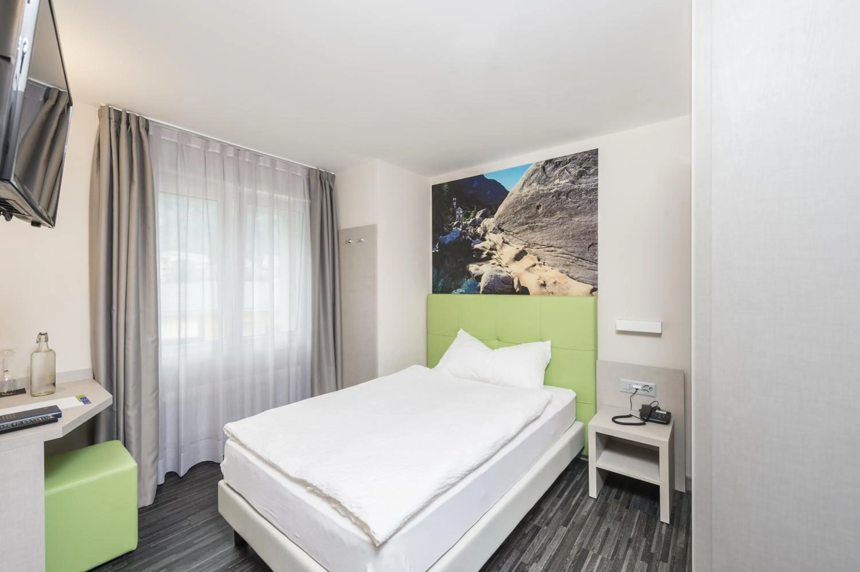 Photo of the whole room, Bed in Adhhoc Hotel