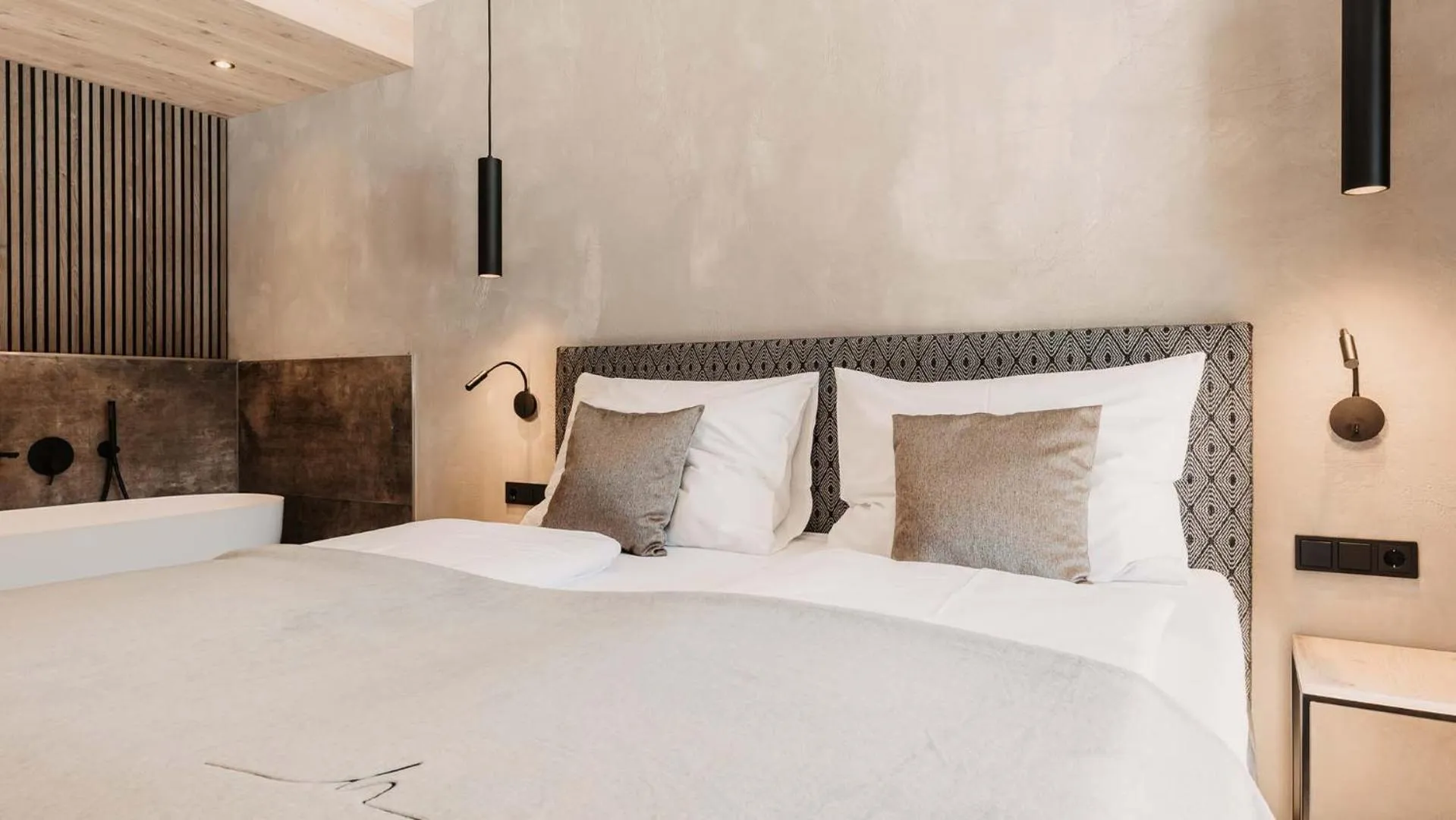 Bed in Hofgut Apartment & Lifestyle Resort Wagrain