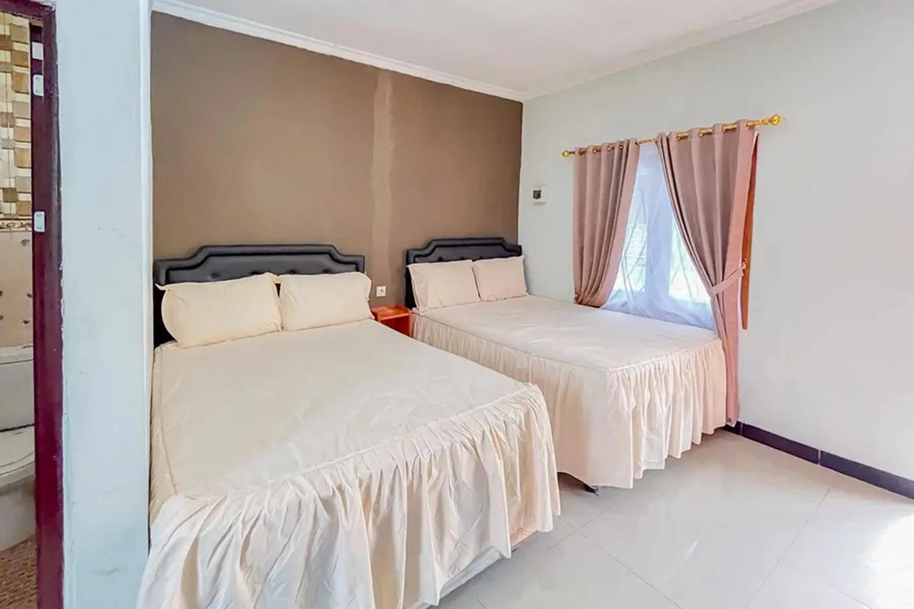 Bed in Villa Kampoeng City Wonosalam Mitra RedDoorz