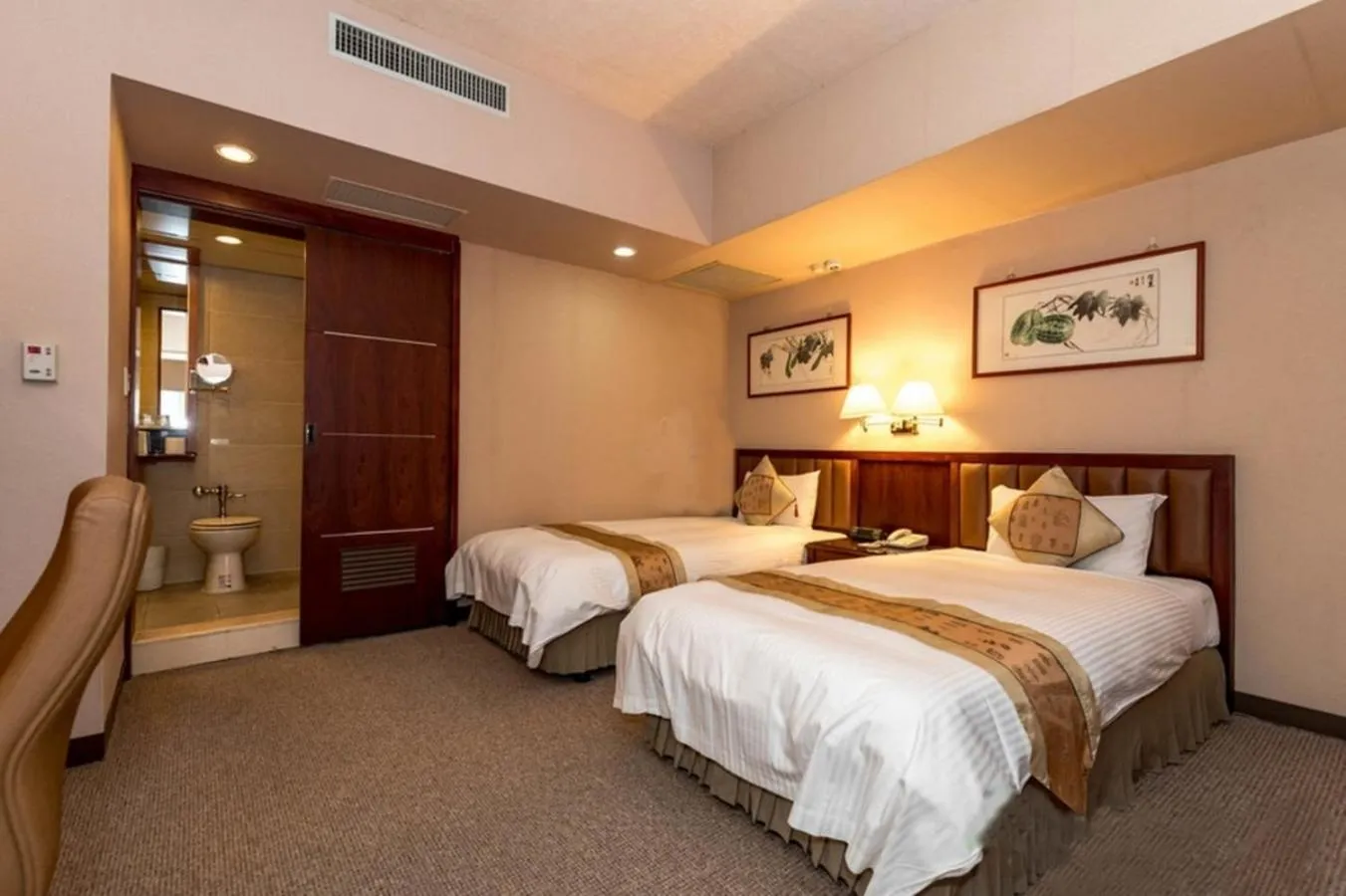 Photo of the whole room, Bed in First Hotel