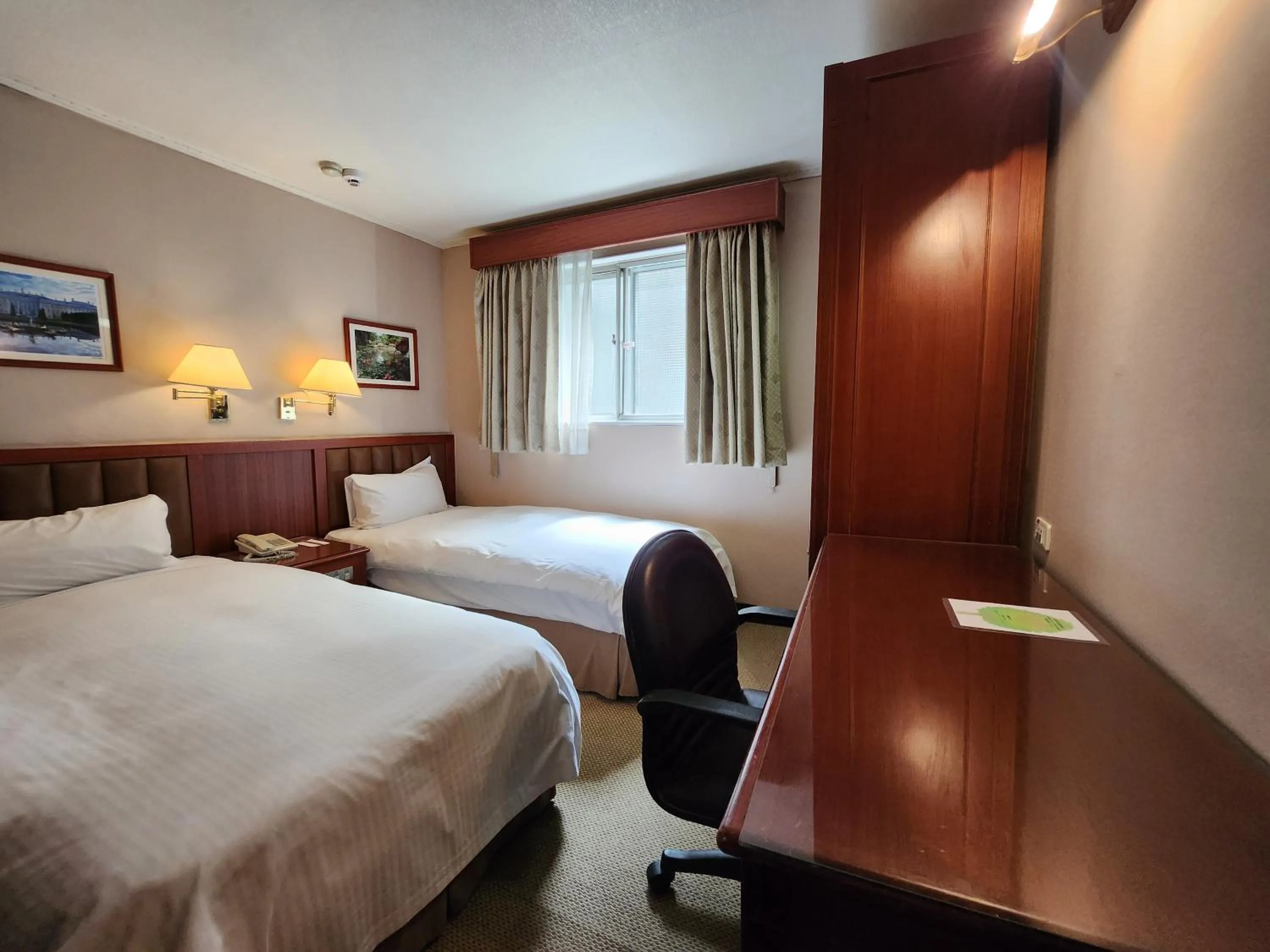 Photo of the whole room, Bed in First Hotel