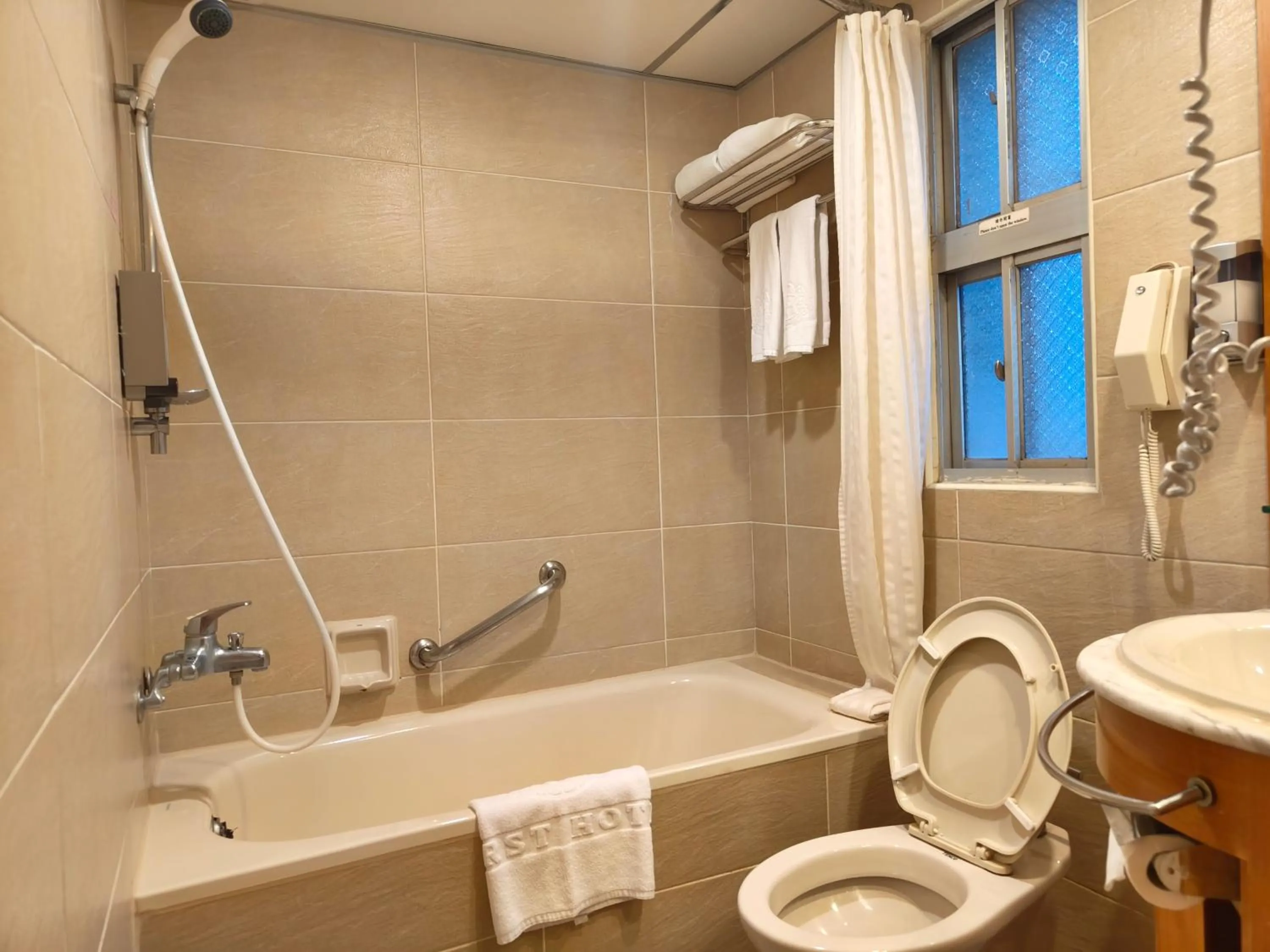 Toilet in First Hotel