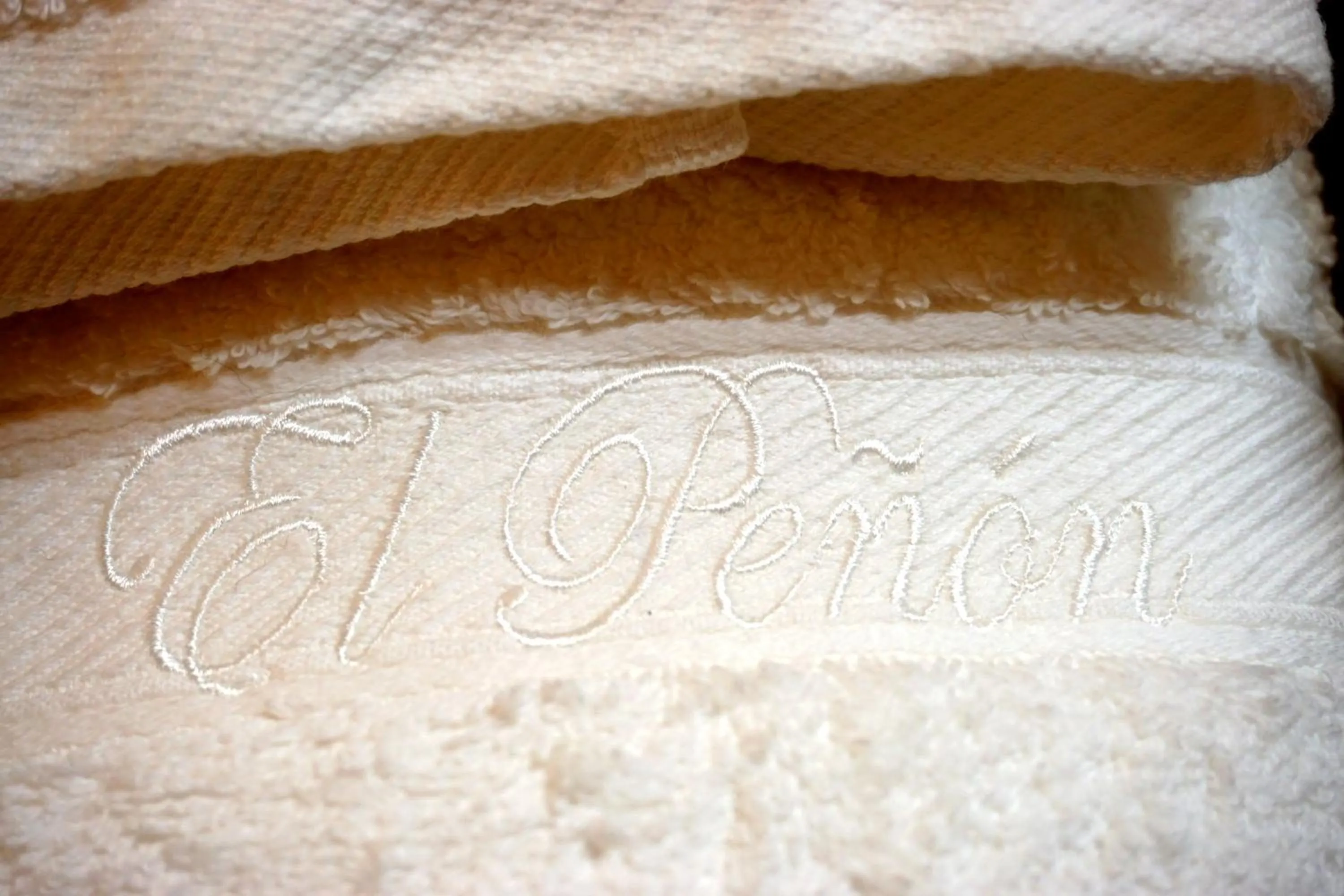 Property logo or sign in Apartamentos Turísticos El Peñón