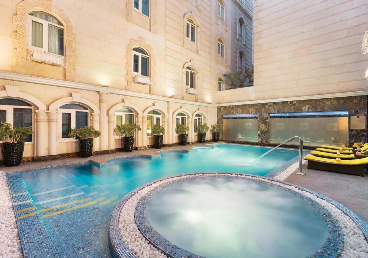 Pool view in Grand Regency Doha, Trademark Collection by Wyndham