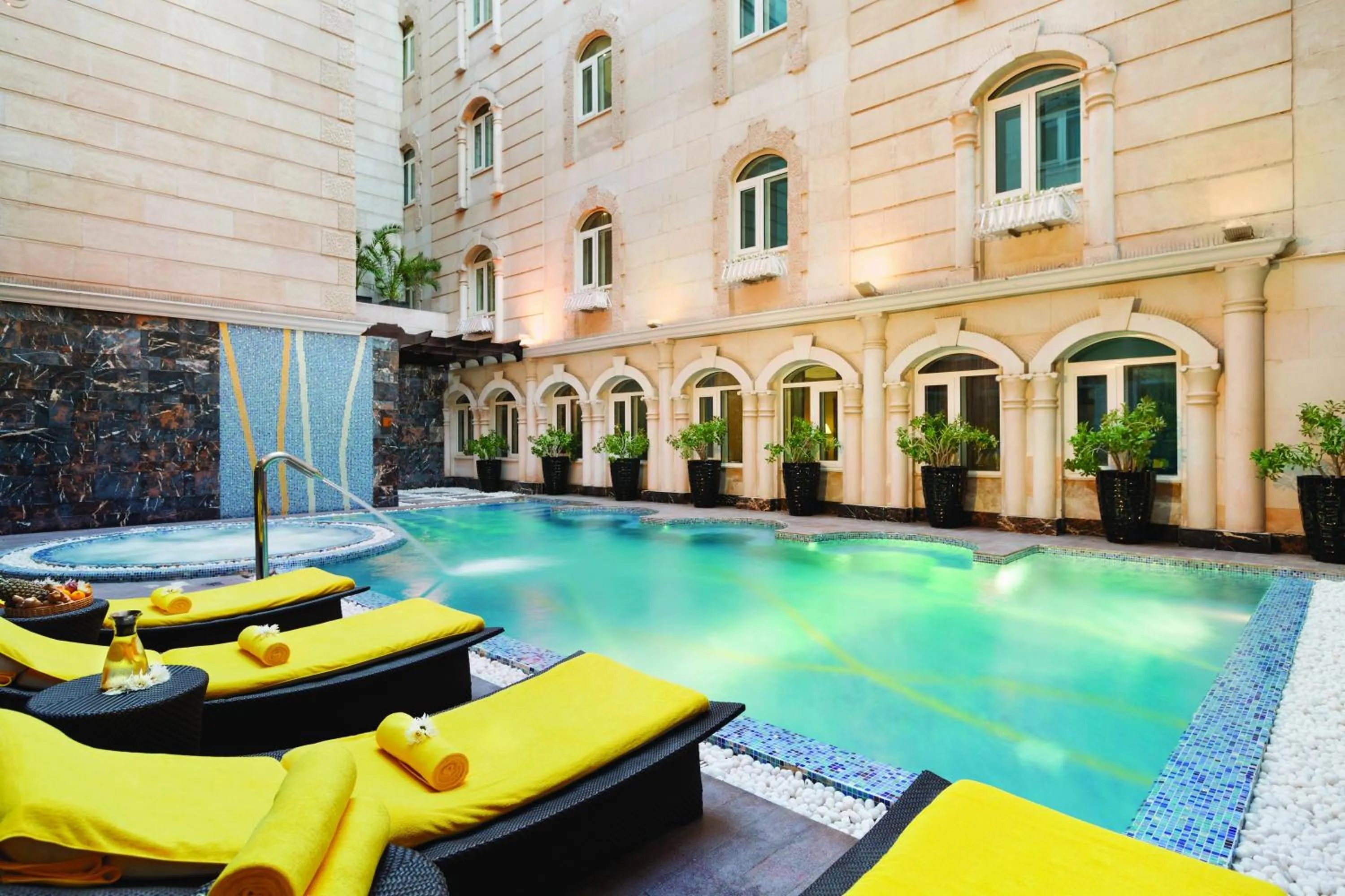 Swimming pool in Grand Regency Doha, Trademark Collection by Wyndham