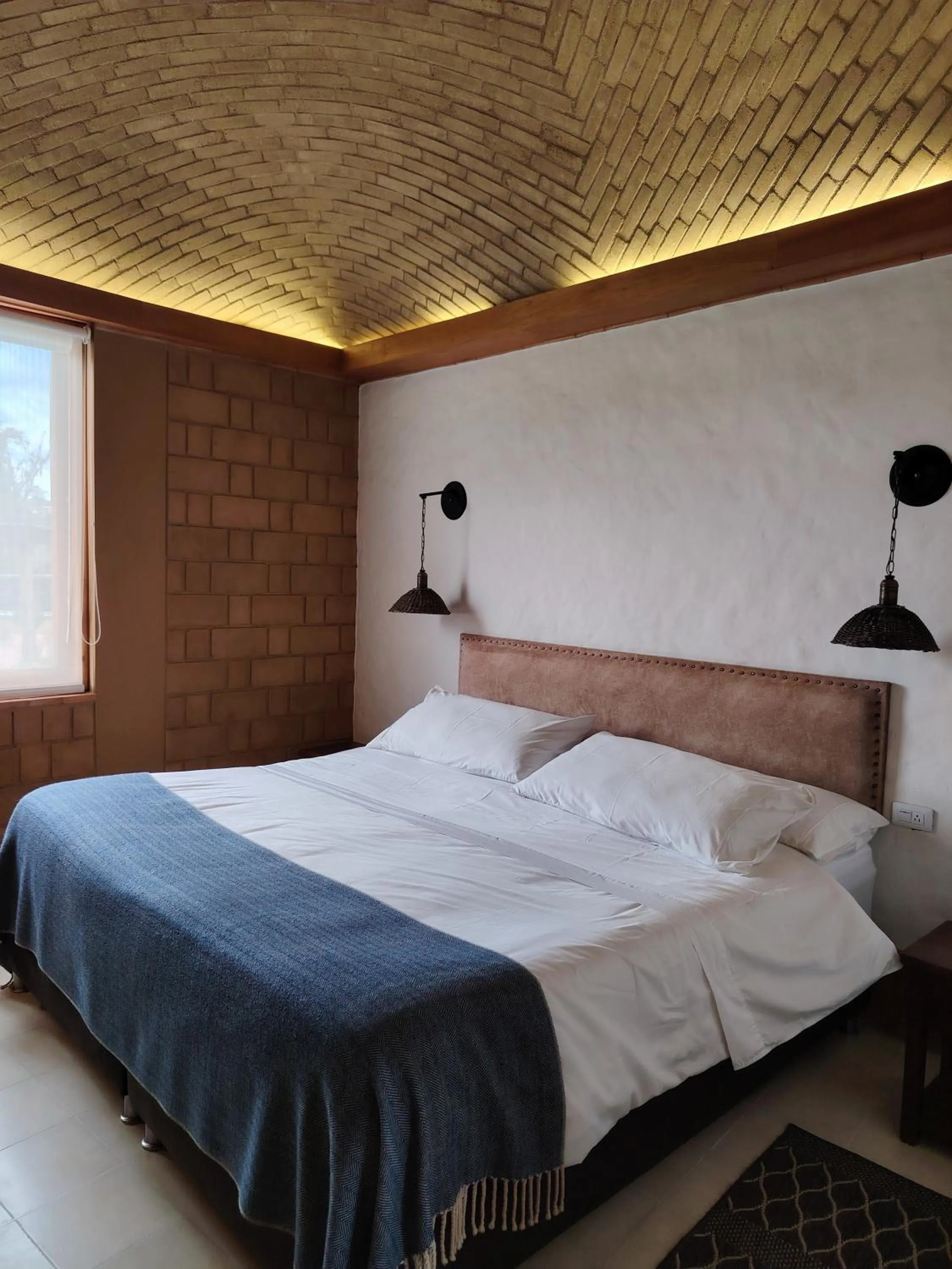 Bed in La Alhambra Hotel Boutique