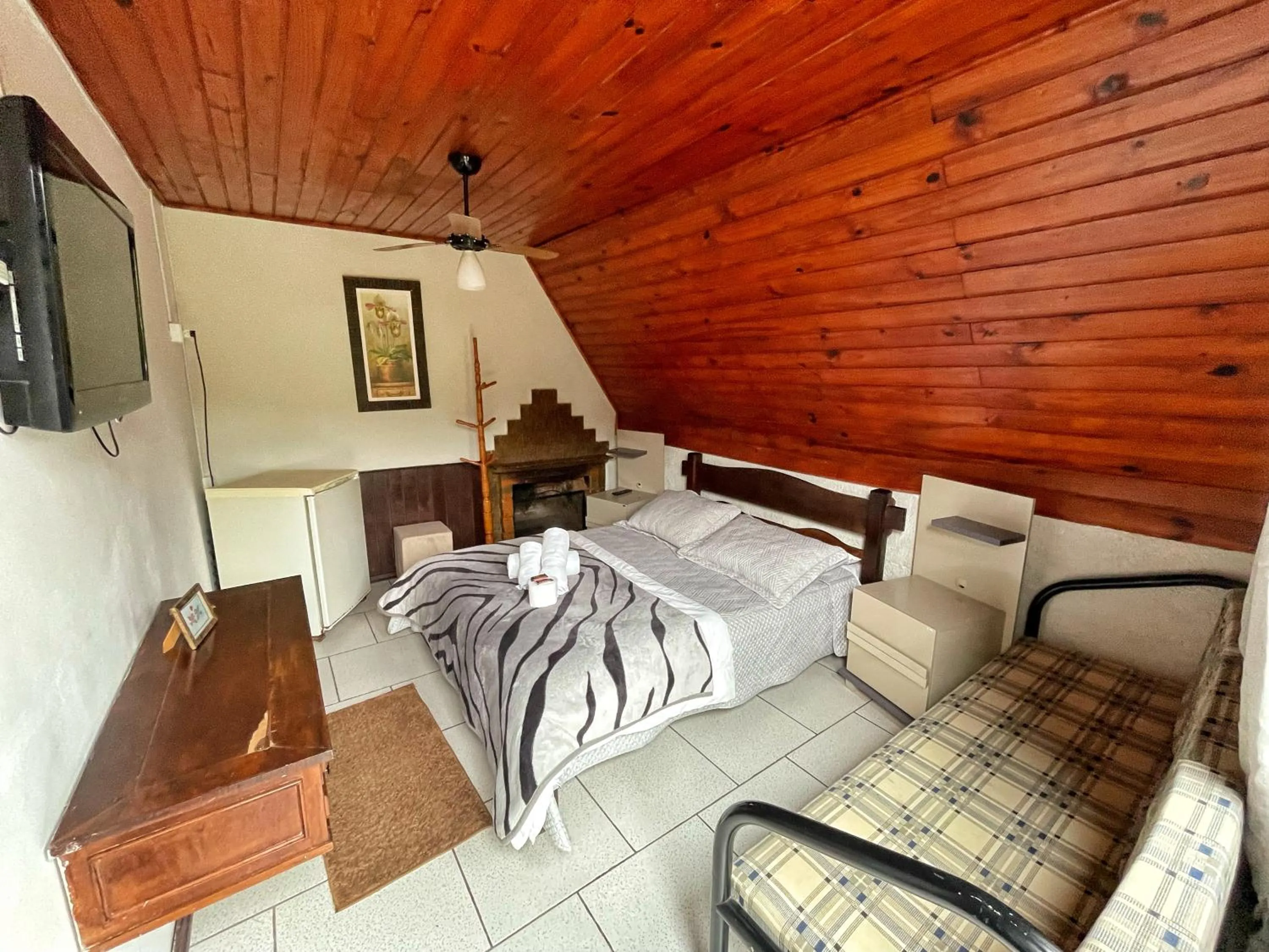 Bed in Pousada Colibri Serrano