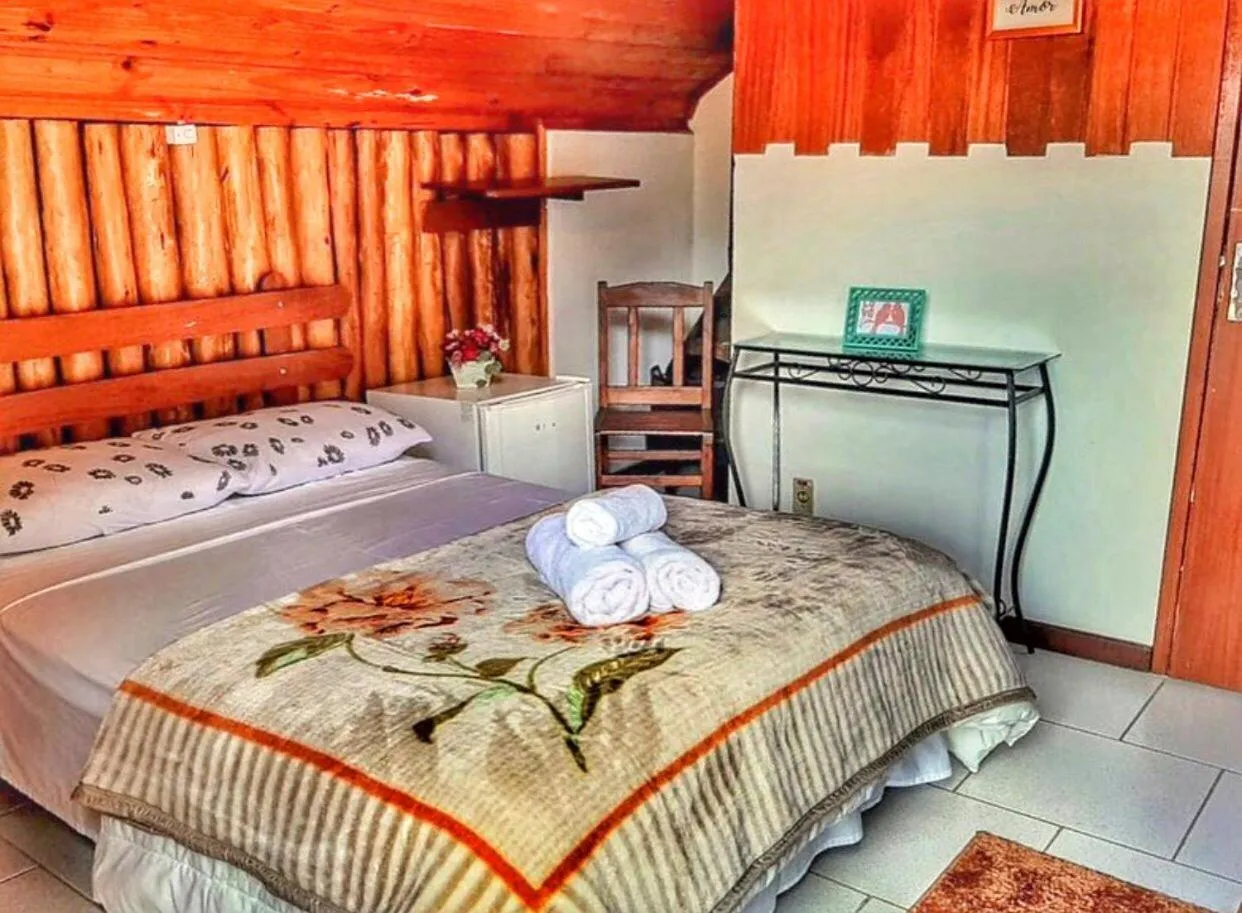 Bed in Pousada Colibri Serrano