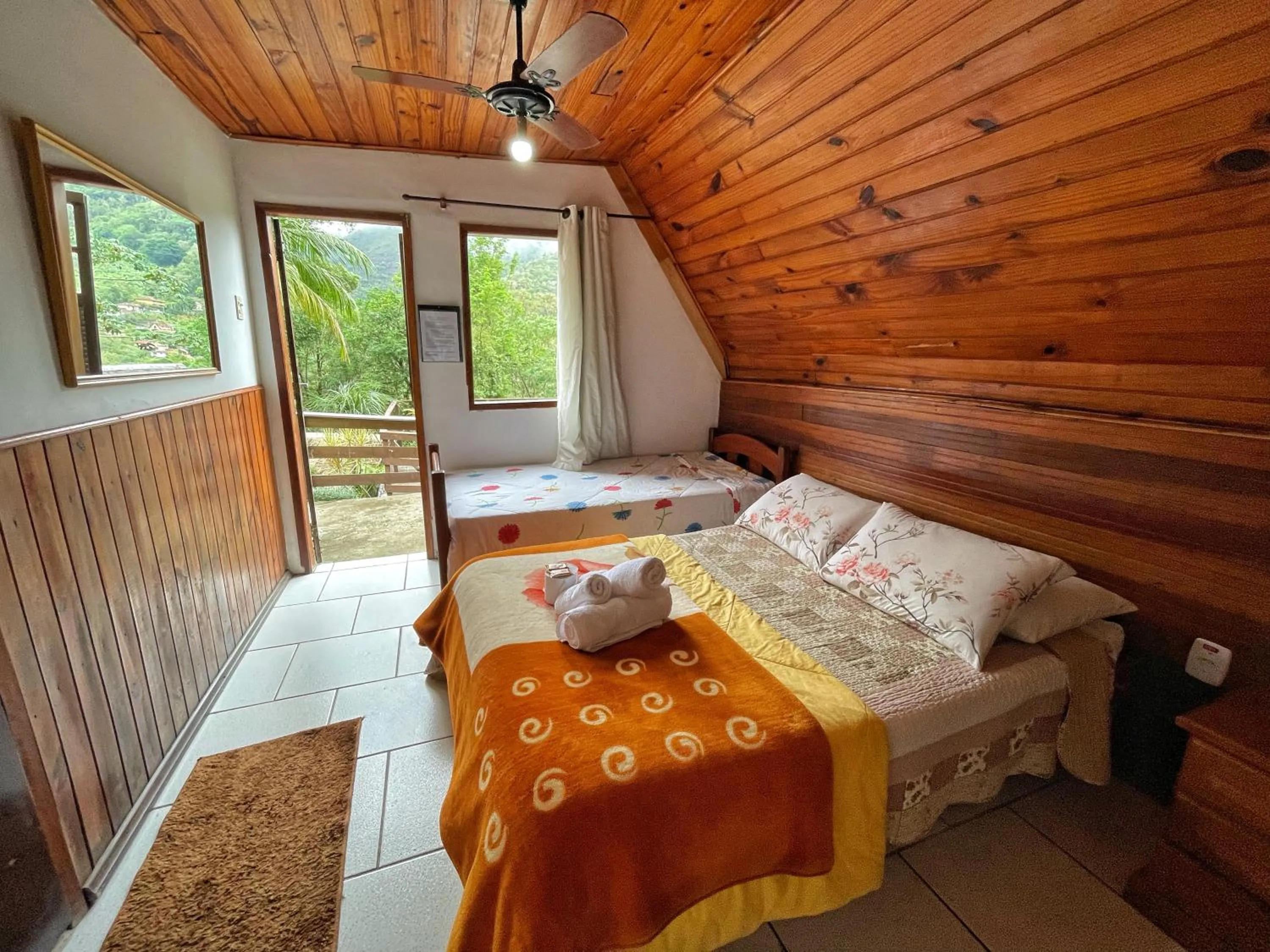 Bed in Pousada Colibri Serrano