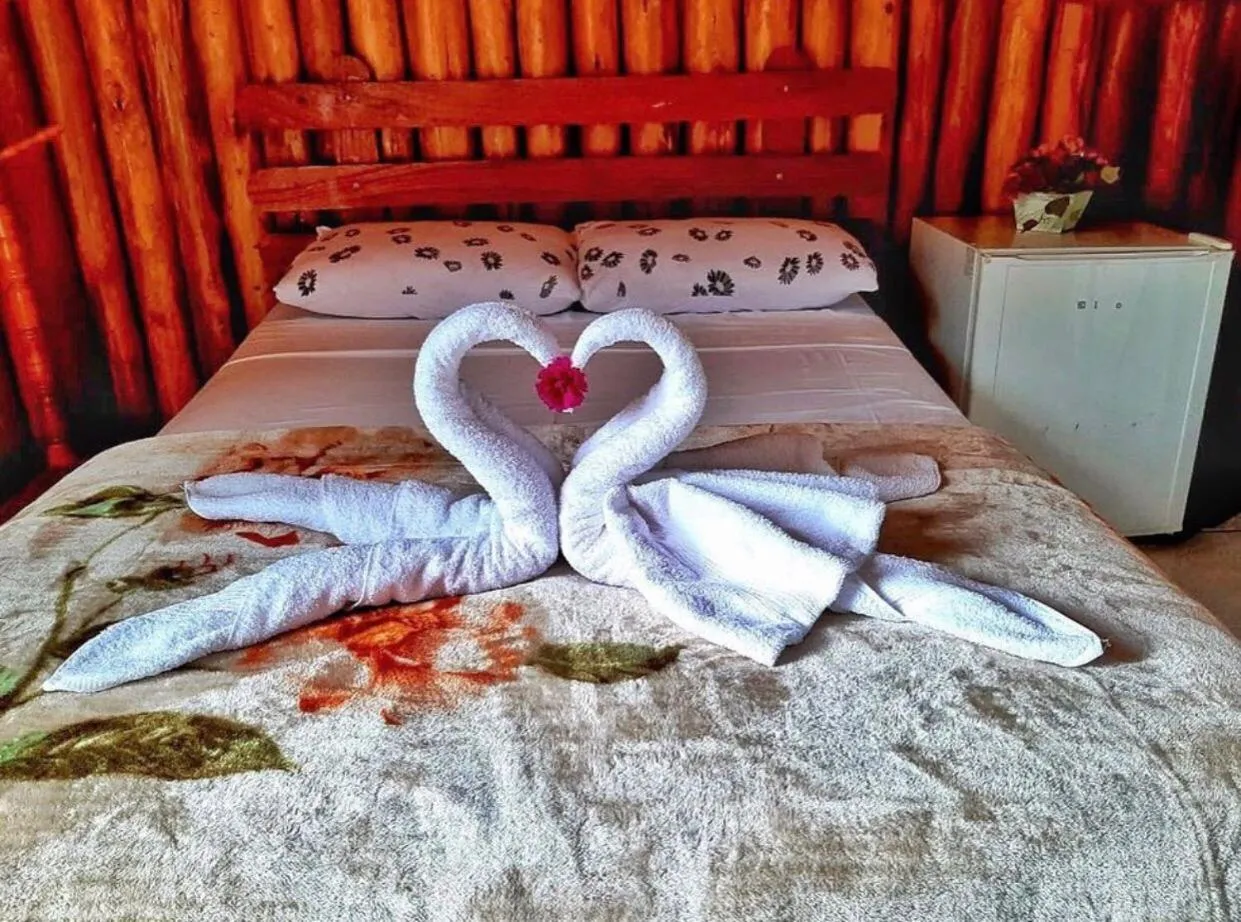 Bed in Pousada Colibri Serrano