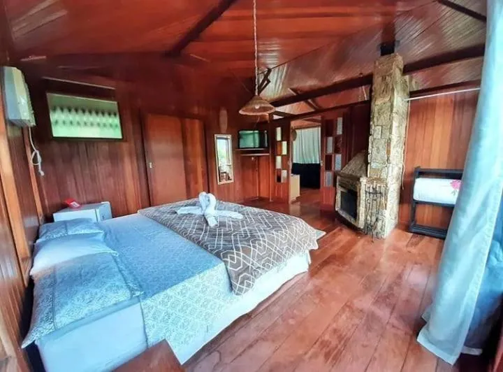 Bed in Pousada Colibri Serrano