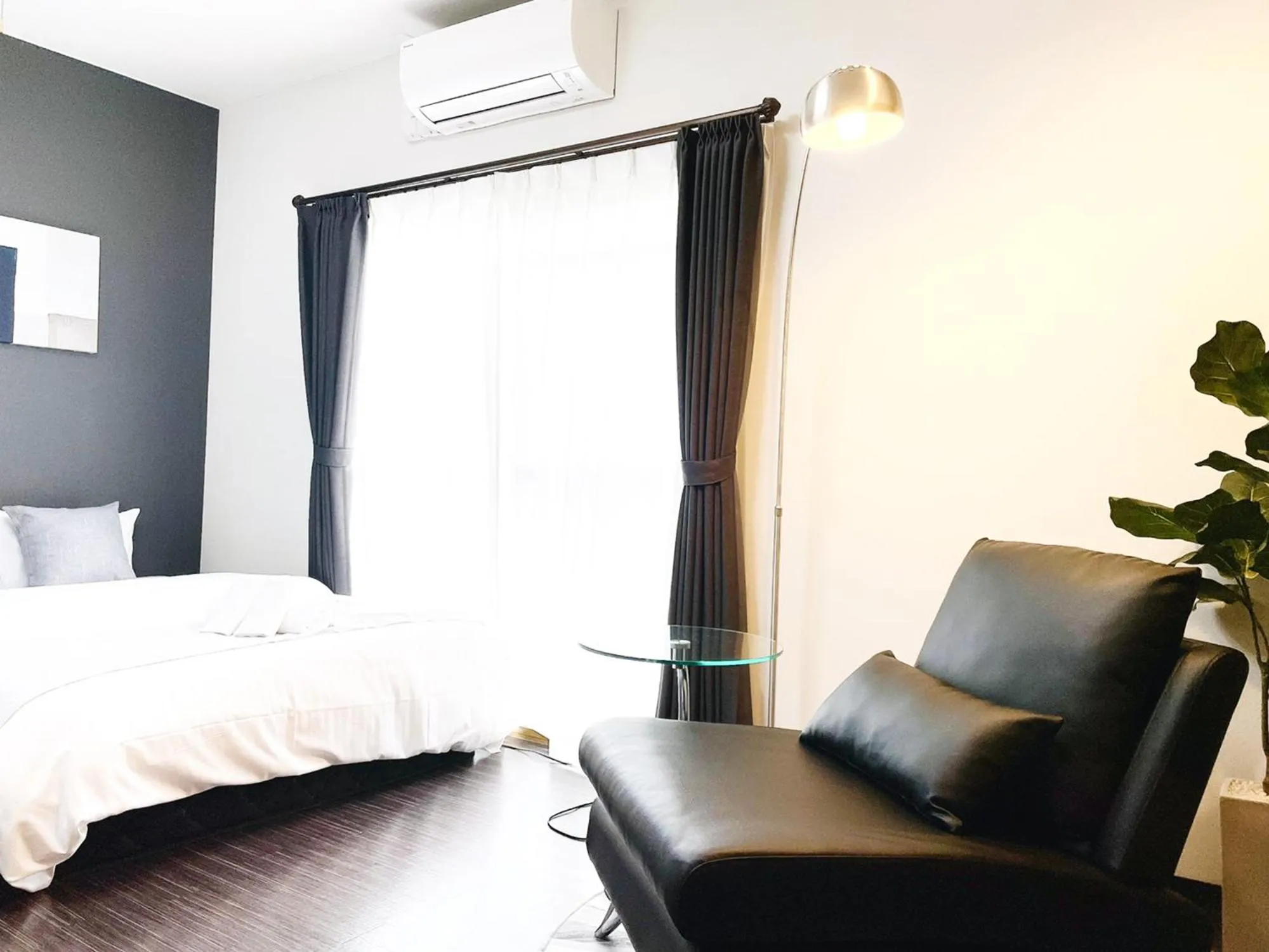 Bed in OUCHI HOTEL SUITE Temma