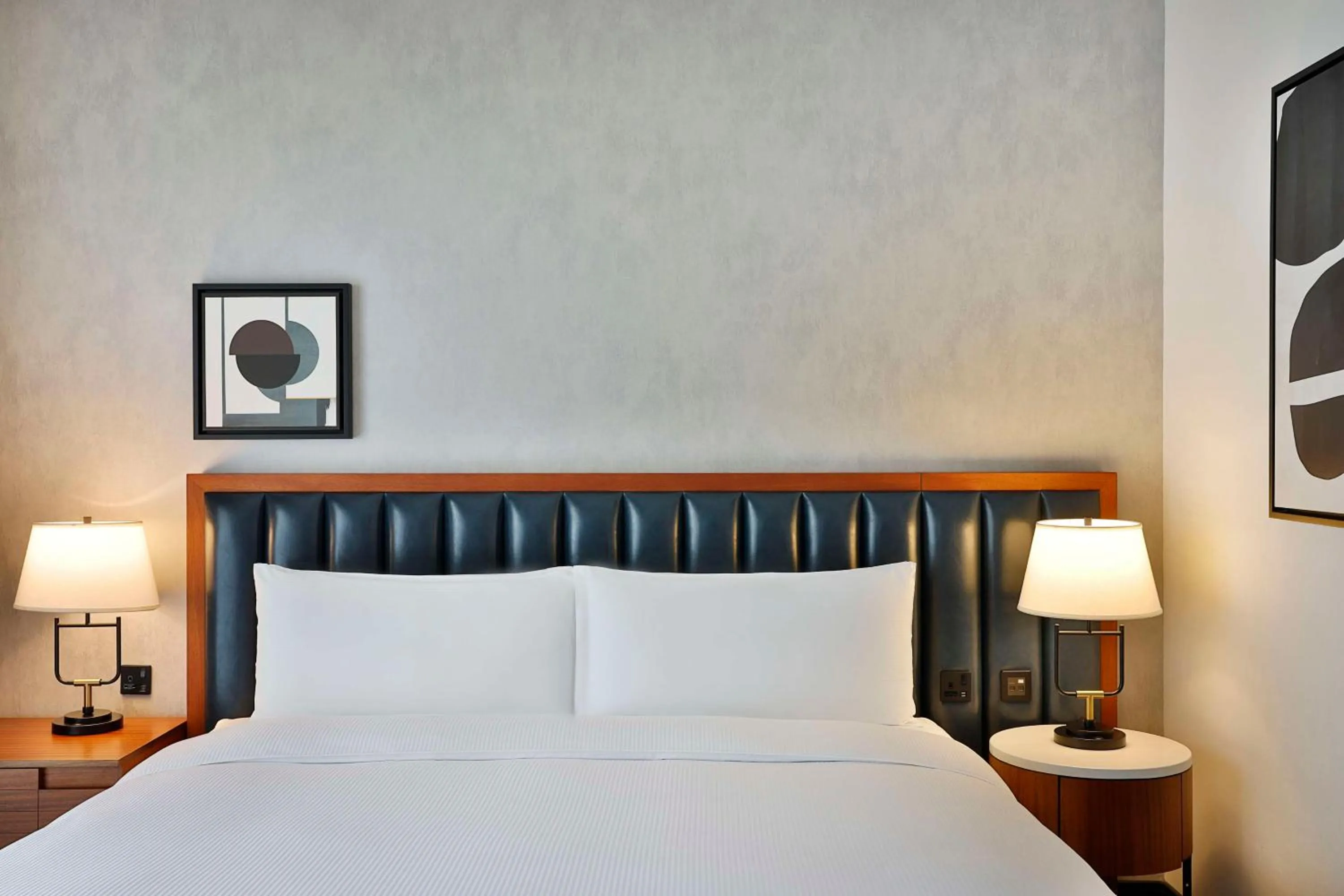 Bed in DoubleTree by Hilton Dubai M Square Hotel & Residences