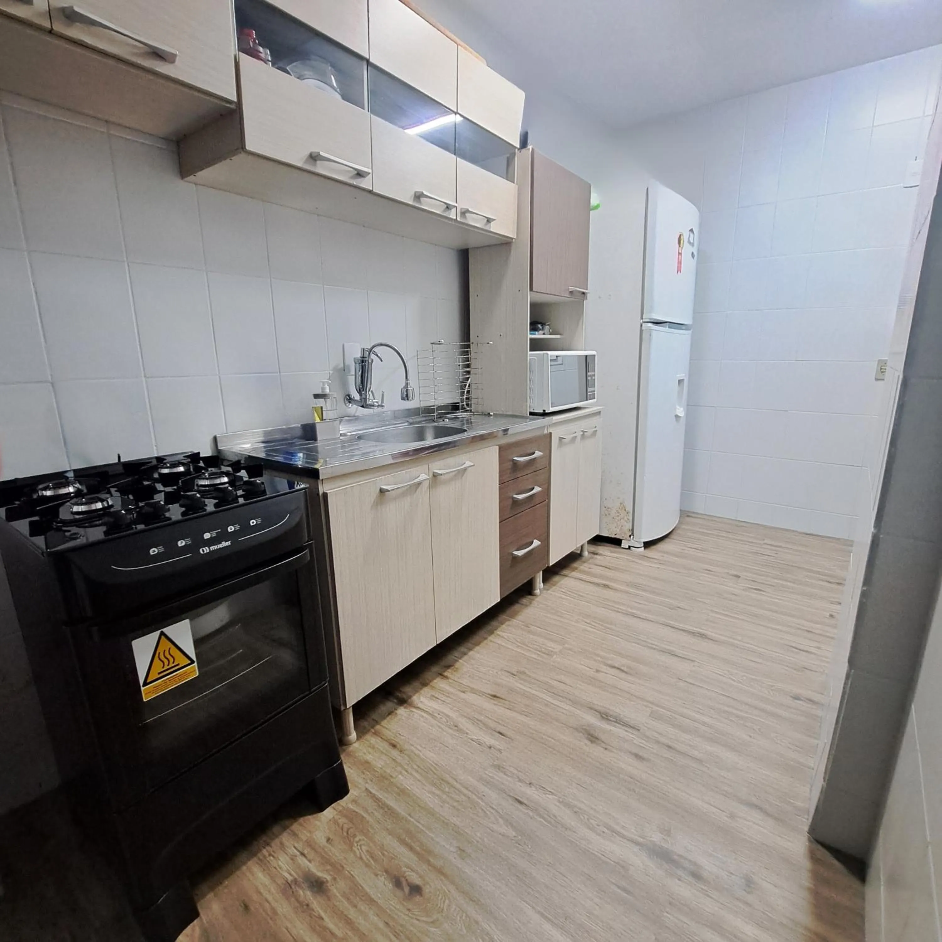 Communal kitchen in Apartamento Temporada Balneário Camboriú