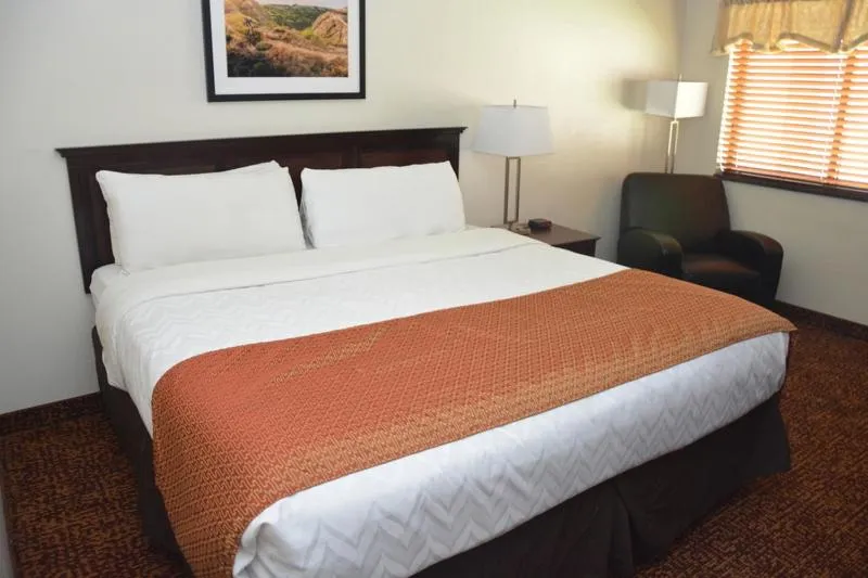 Bed in Roosevelt Inn & Suites