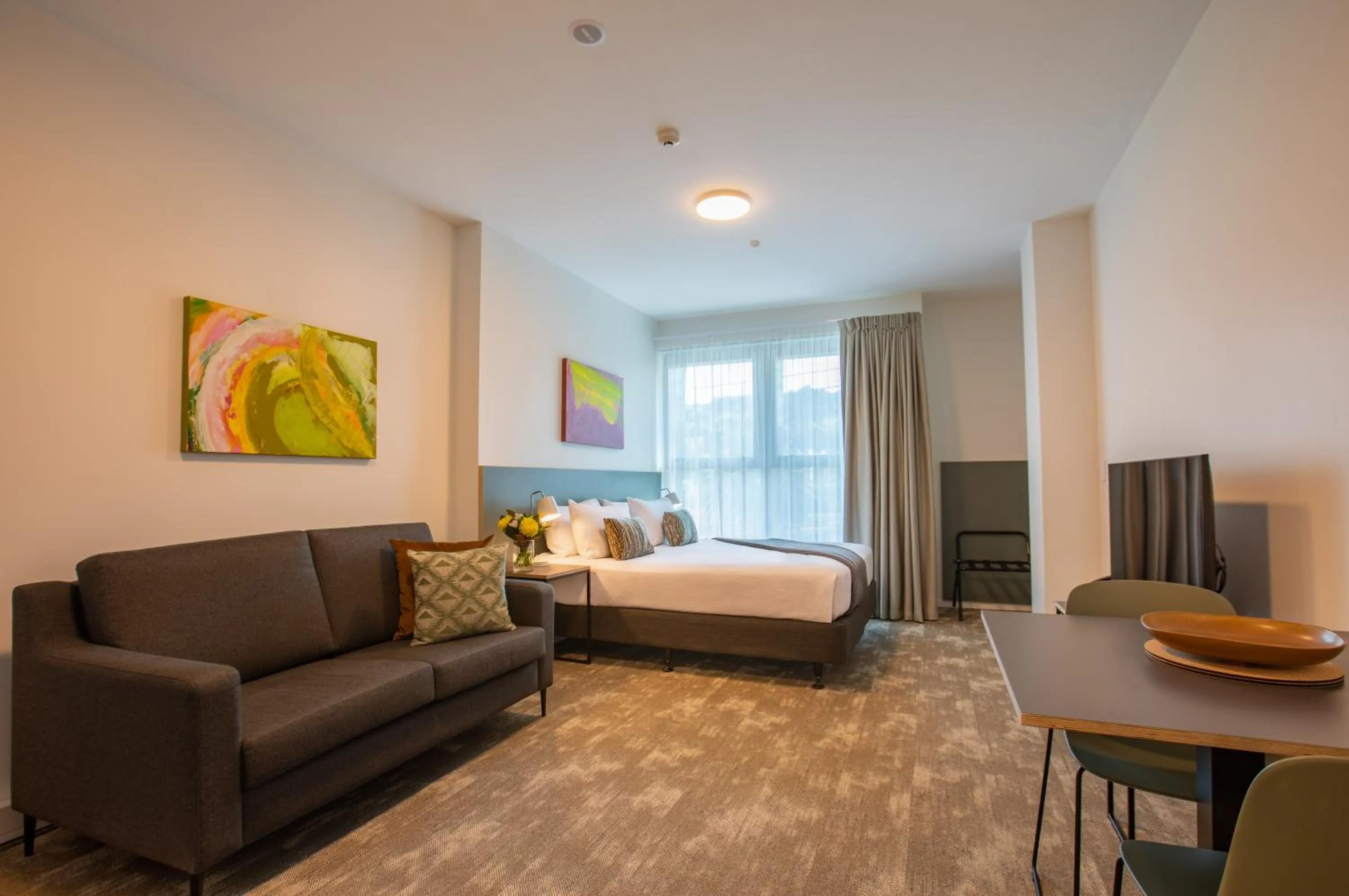 Living room, Bed in Sojourn Apartment Hotel - Riddiford