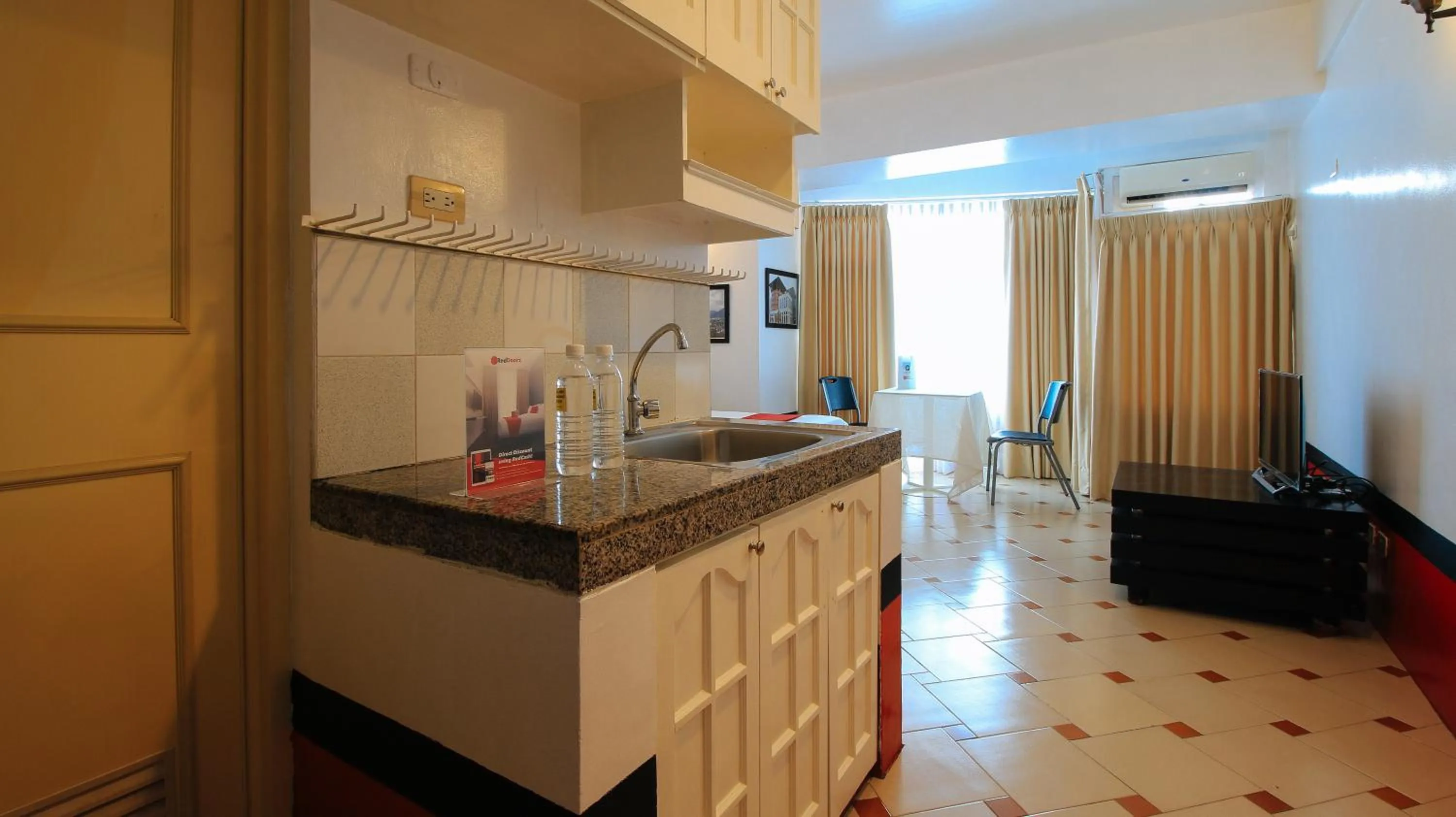 Kitchen or kitchenette in RedDoorz at The Providence Tower