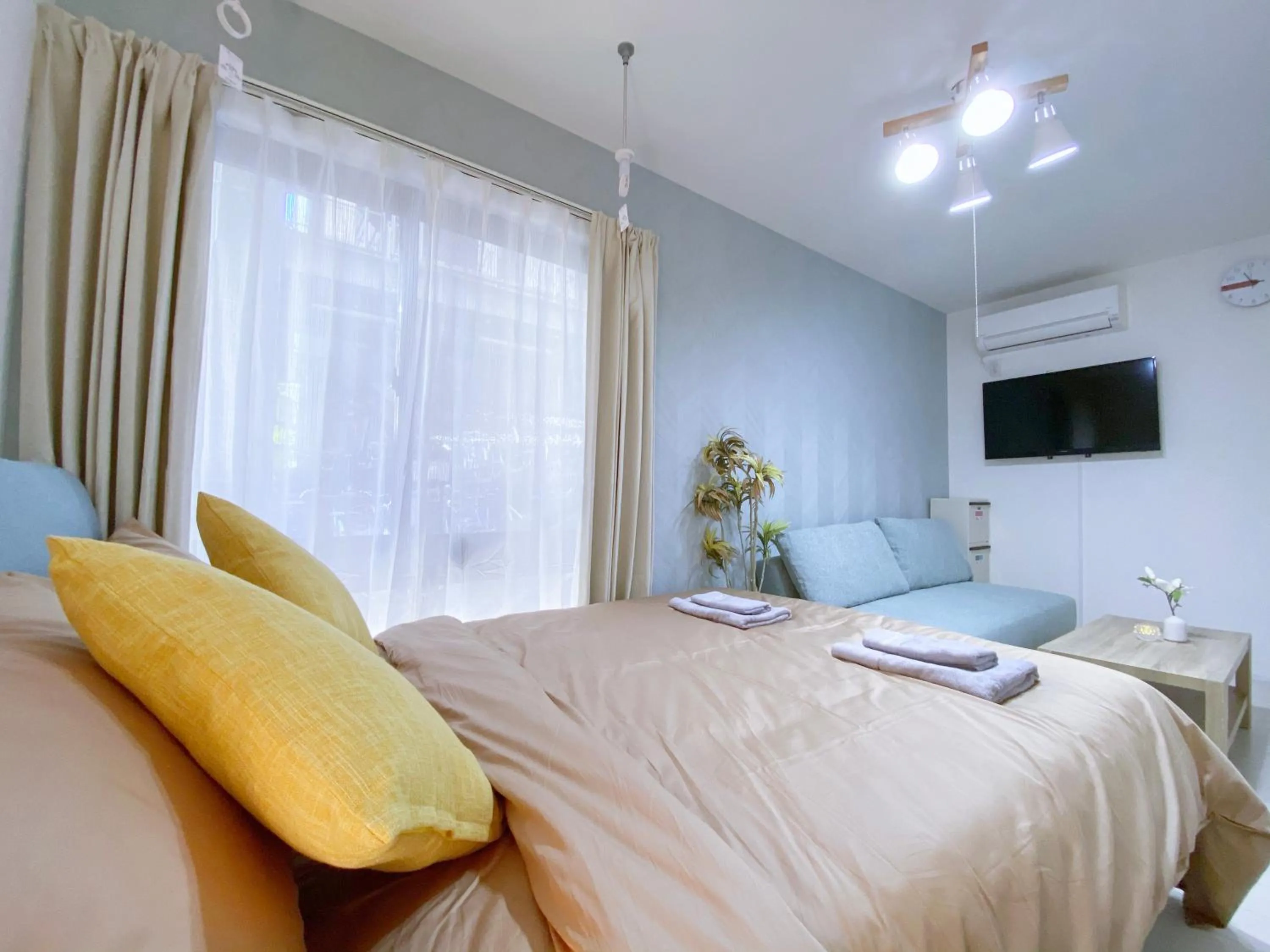 Bed in nestay apartment tokyo ginza