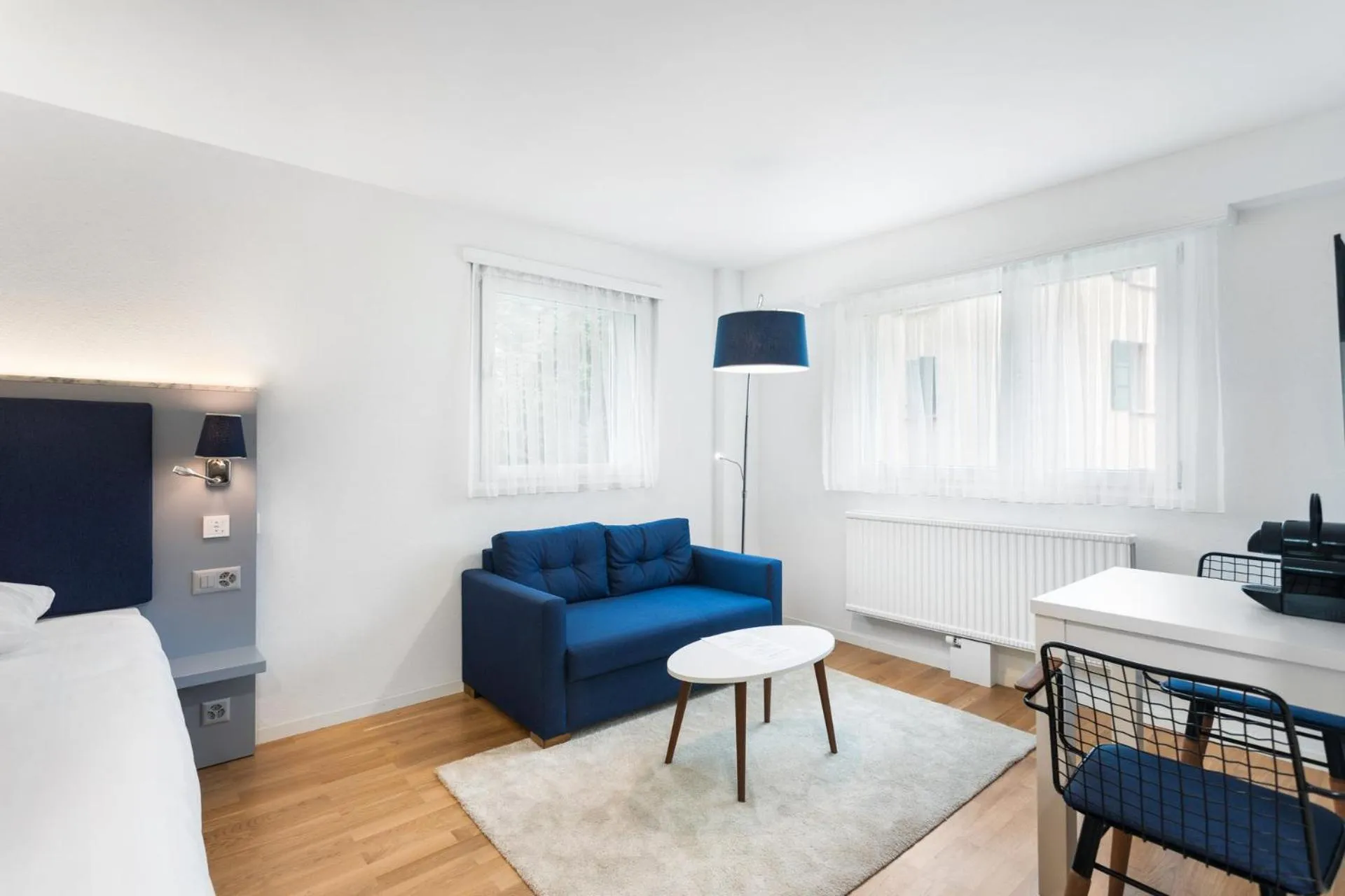 Seating area in Berne 2 - Self Check In by Homenhancement