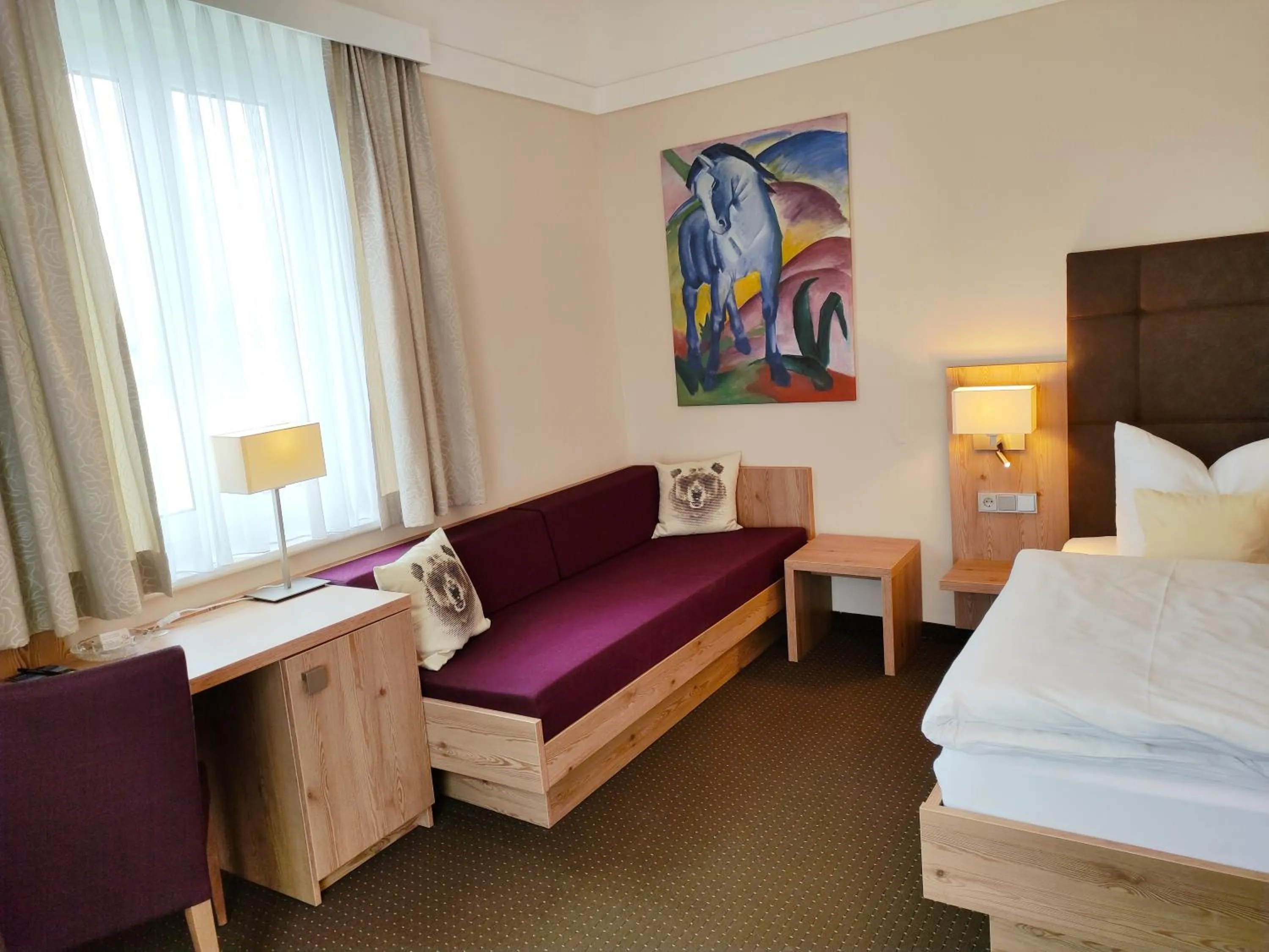 Photo of the whole room, Bed in Seehotel Grauer Bär