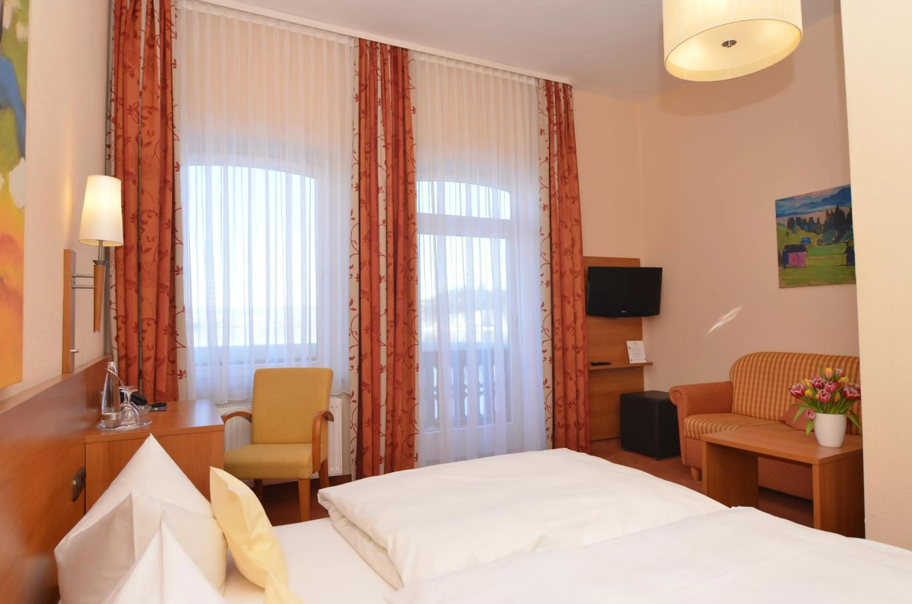 Photo of the whole room, Bed in Seehotel Grauer Bär