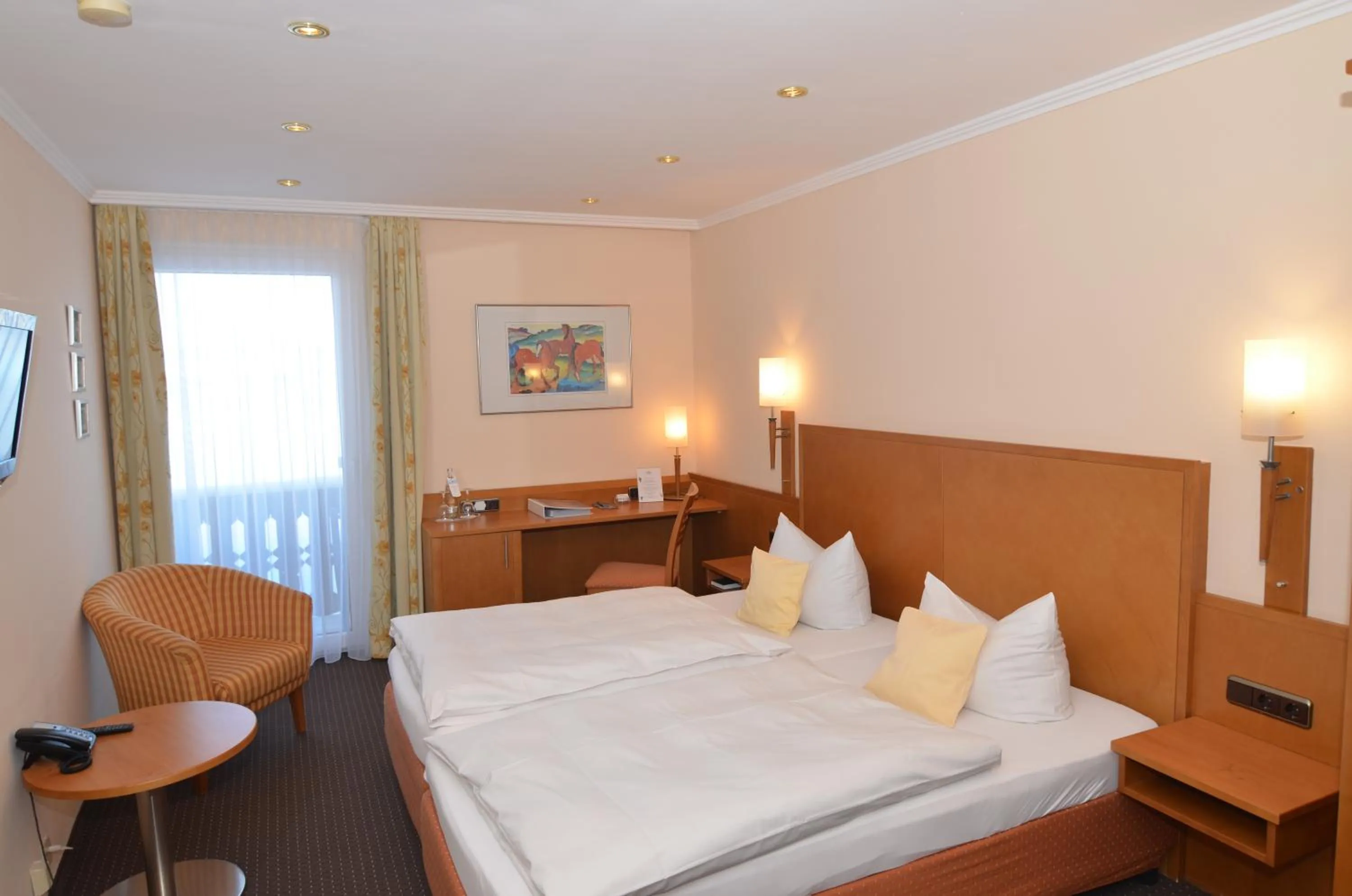 Photo of the whole room, Bed in Seehotel Grauer Bär