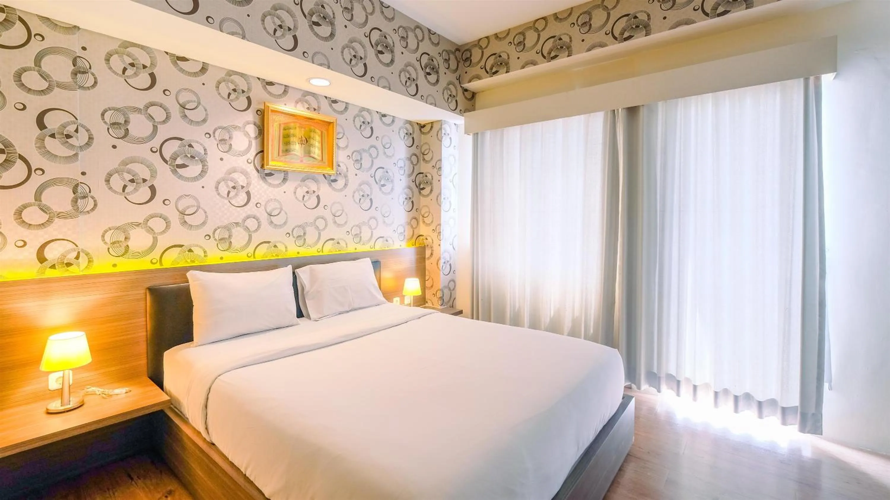 Bed in Minimalist Studio at 11st Floor Bogor Icon Apartment By Travelio