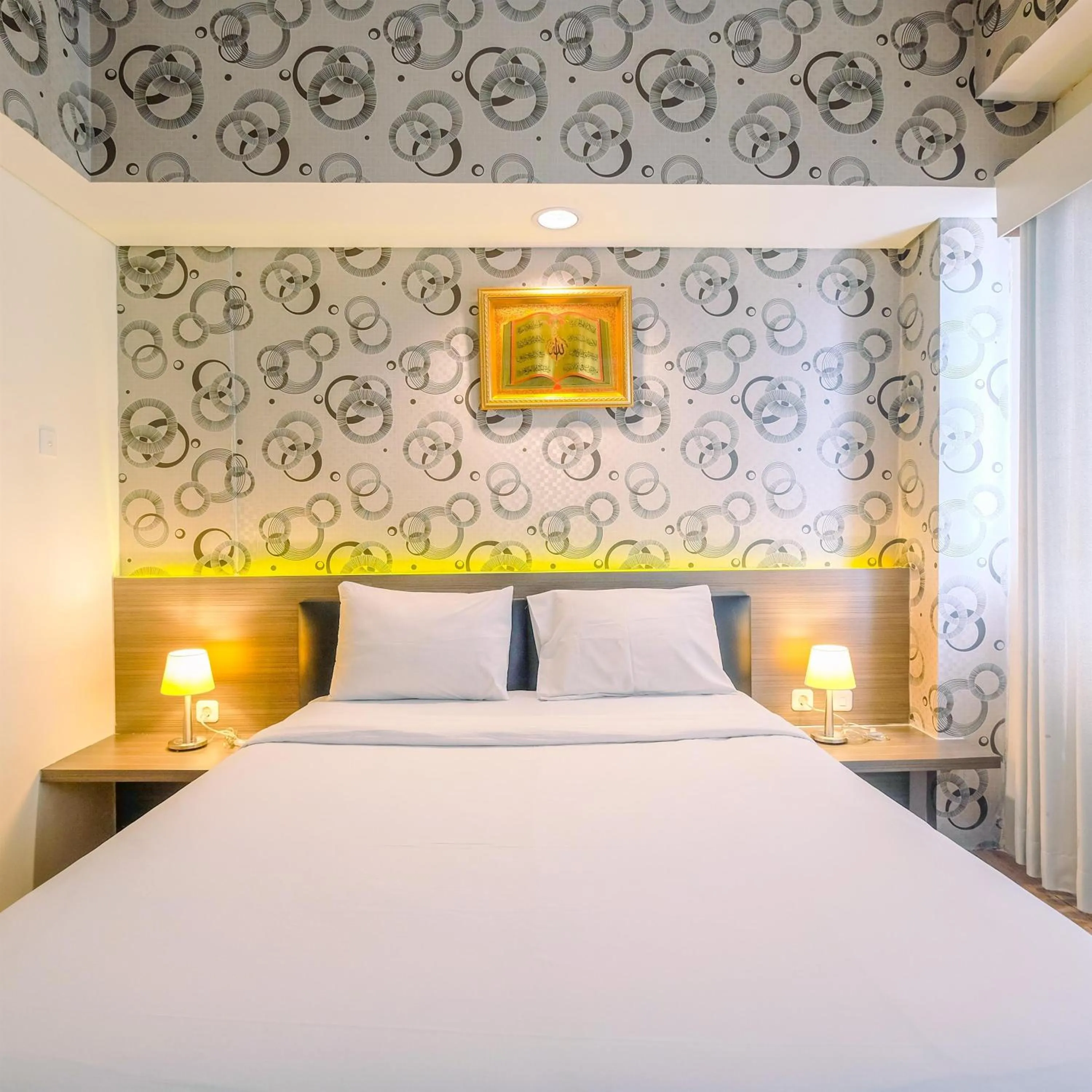 Bed in Minimalist Studio at 11st Floor Bogor Icon Apartment By Travelio