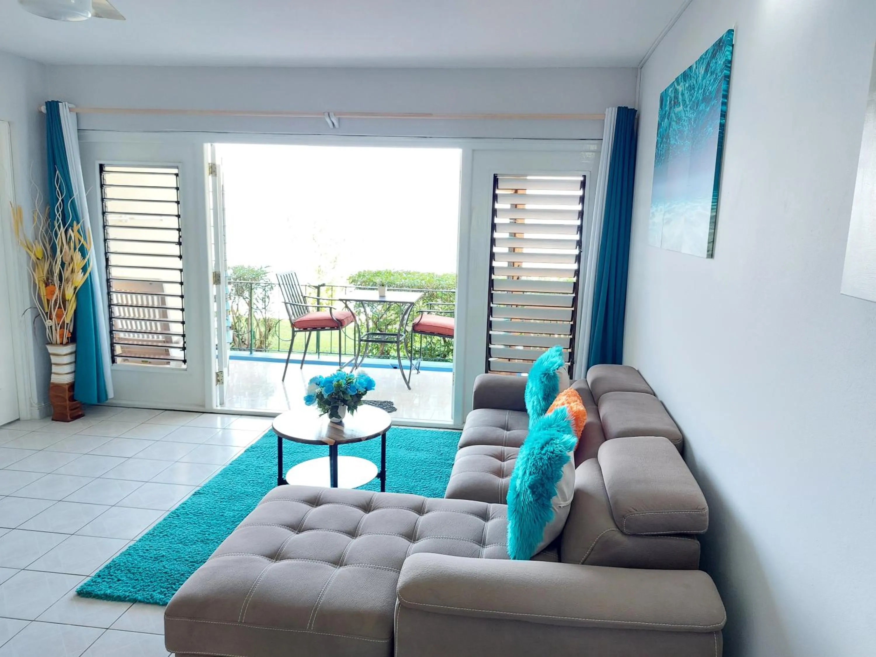 Living room in Contemporary Ocean view 2bed Carib Ocho Rios Condo