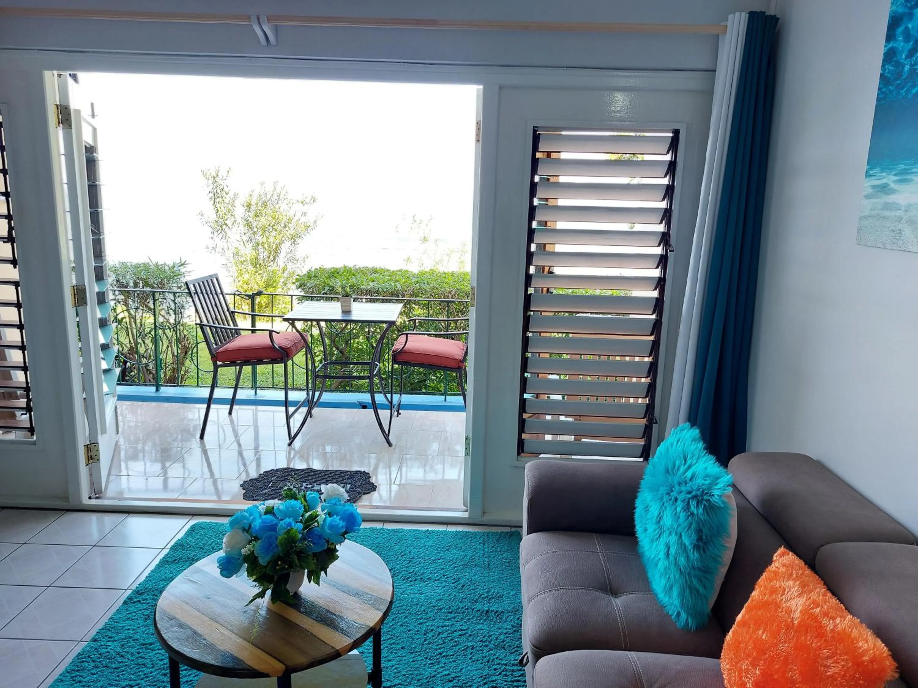 Living room in Contemporary Ocean view 2bed Carib Ocho Rios Condo