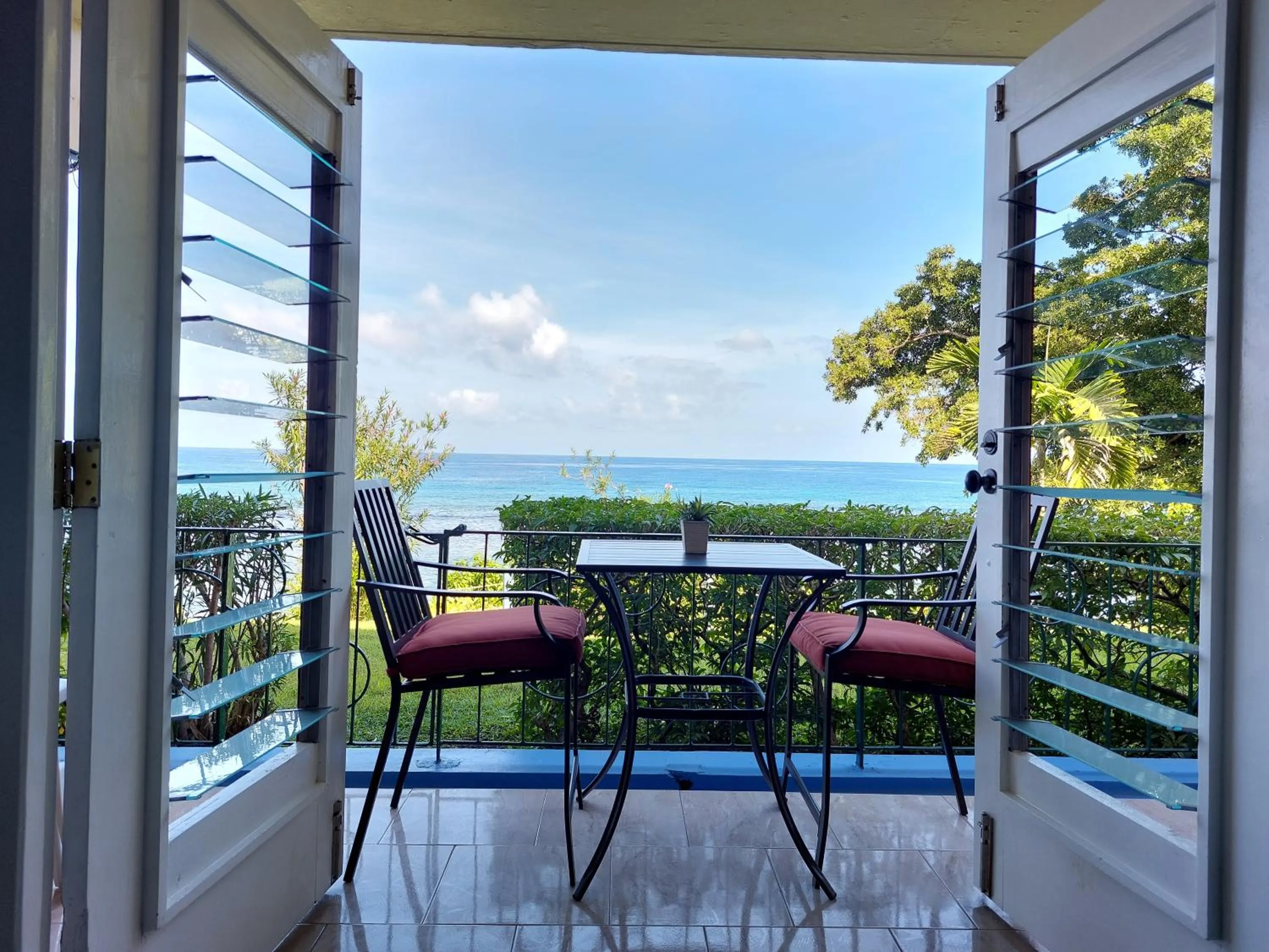 Patio in Contemporary Ocean view 2bed Carib Ocho Rios Condo
