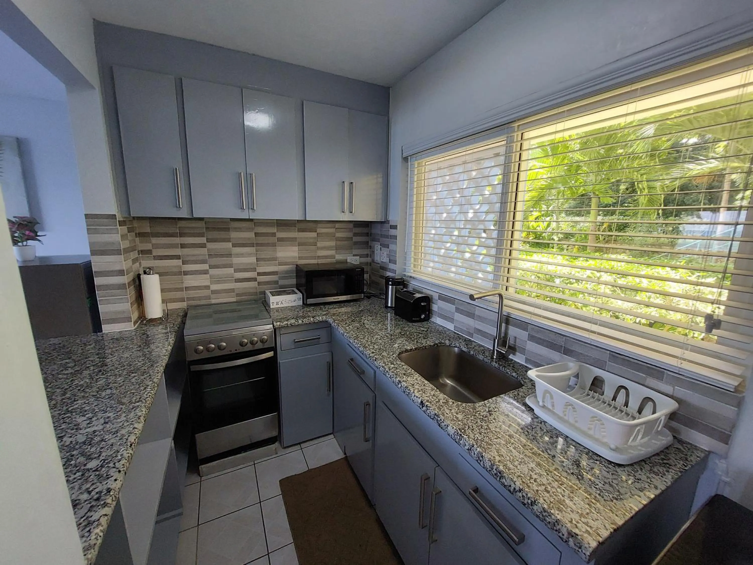 Kitchen or kitchenette in Contemporary Ocean view 2bed Carib Ocho Rios Condo