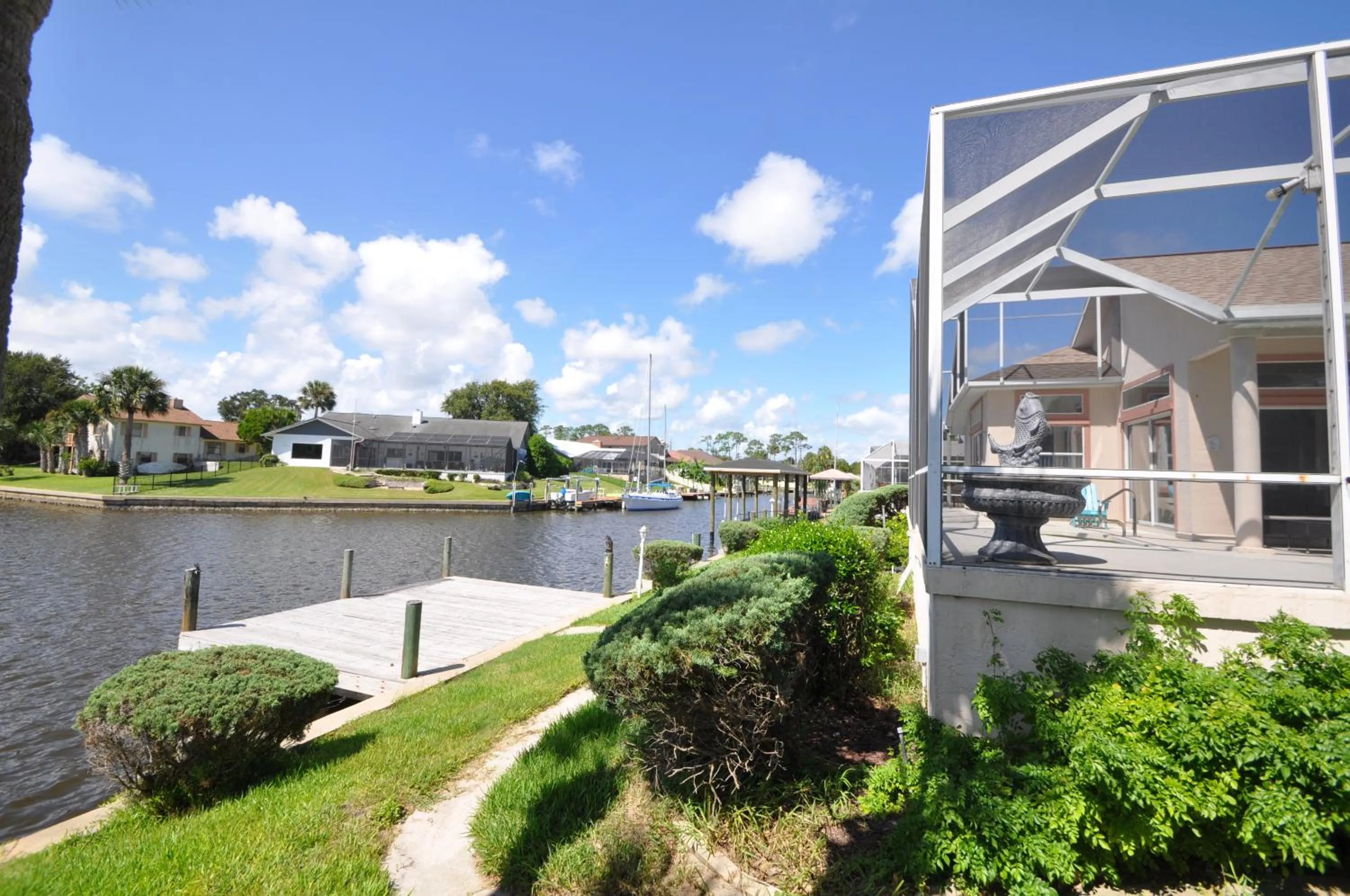 Sunset Bay Beautiful Pool Home - Bring Your Boat or Jet Ski - Canal with Dock- Sleeps 10 - 4 BD