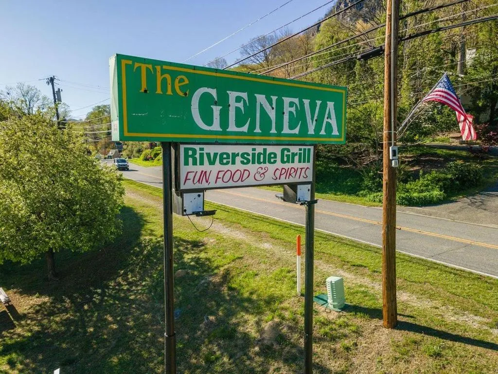 Property logo or sign in Geneva Hotel & Tiki Bar