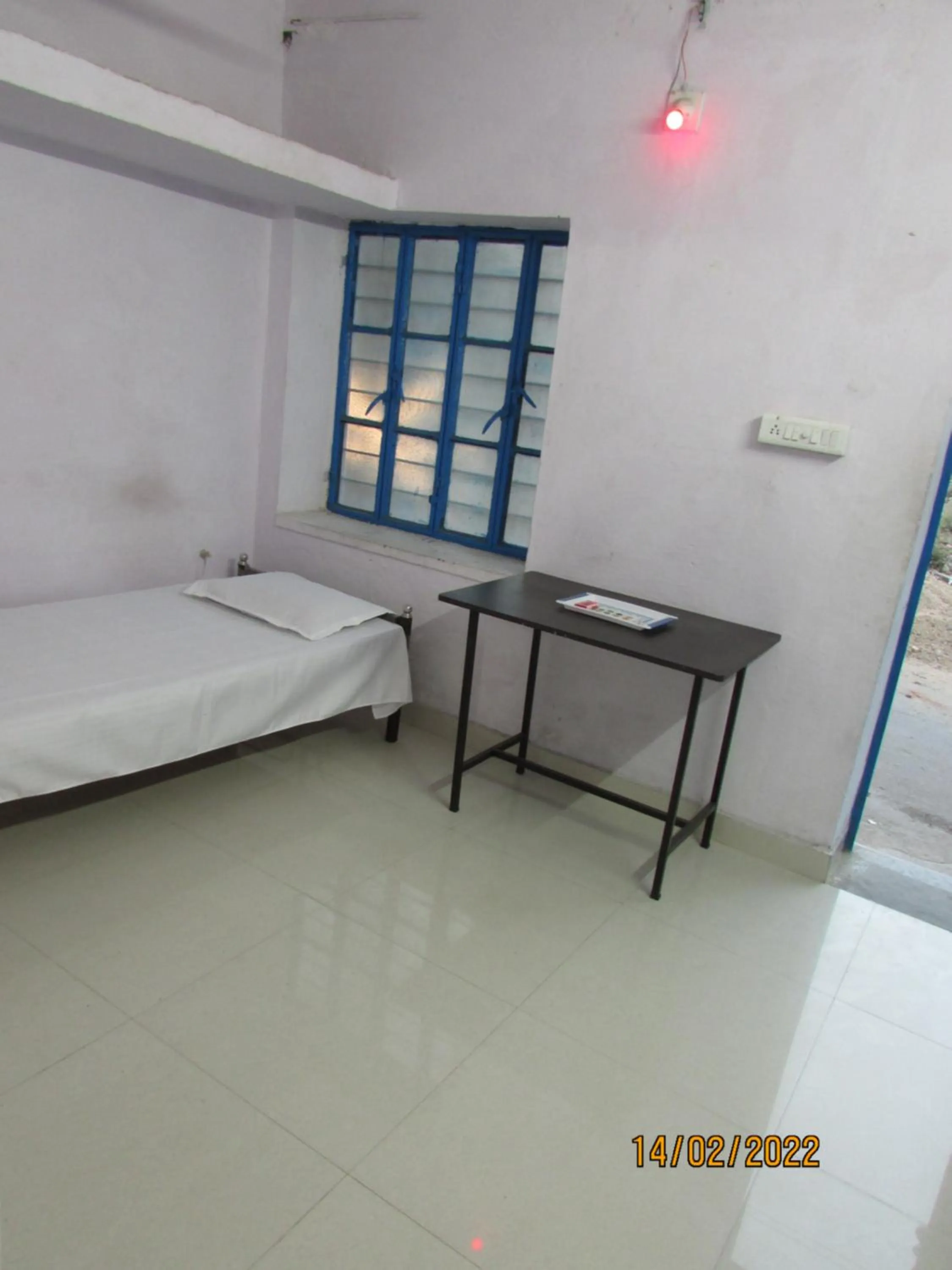 Bed in Ashish Guest House, Goverdhan Vilas