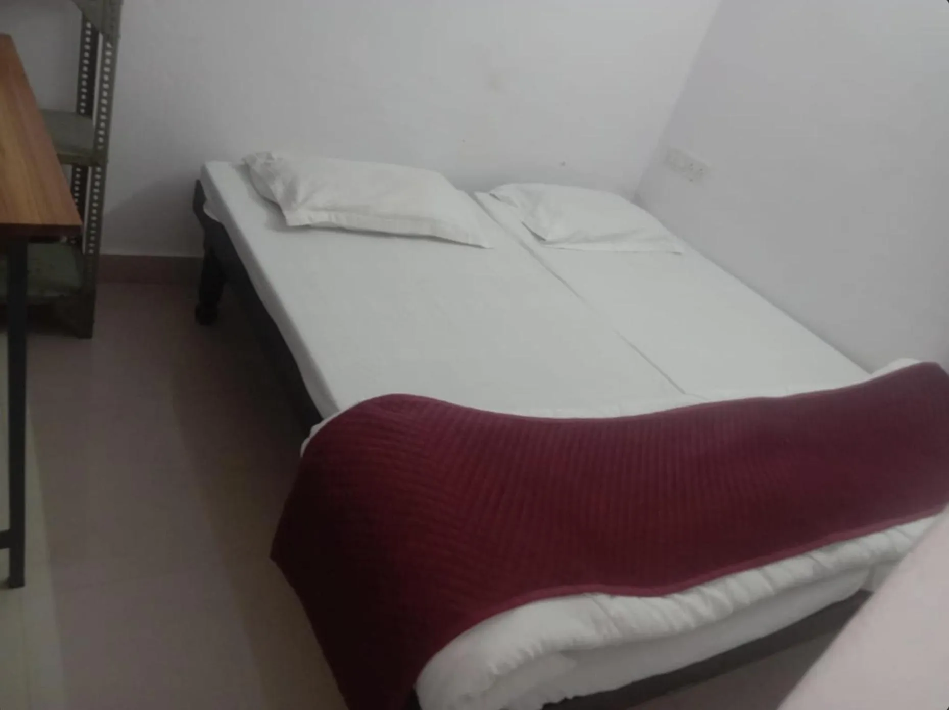 Bed in Ashish Guest House, Goverdhan Vilas