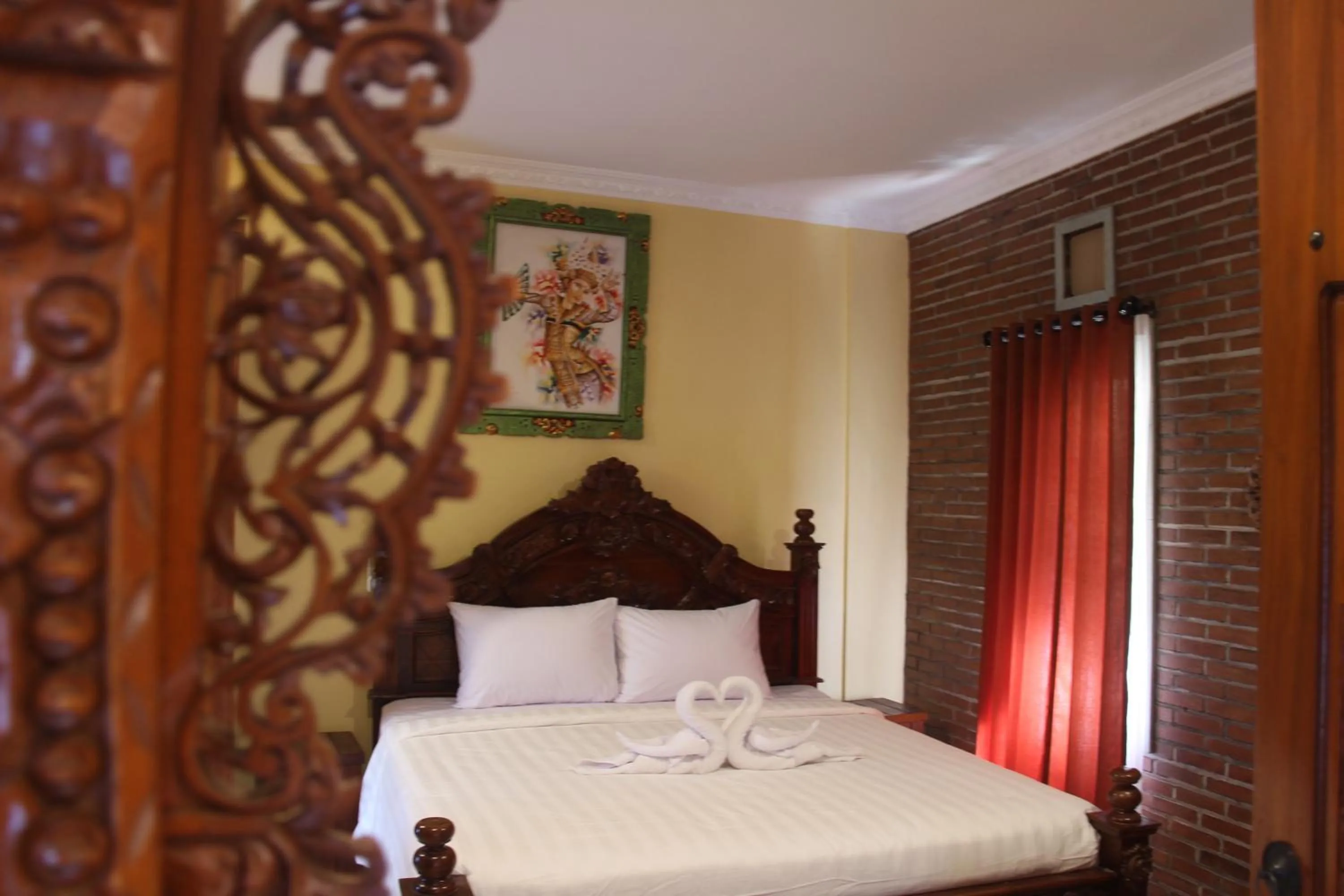 Bed in The Garuda Homestay Sanur