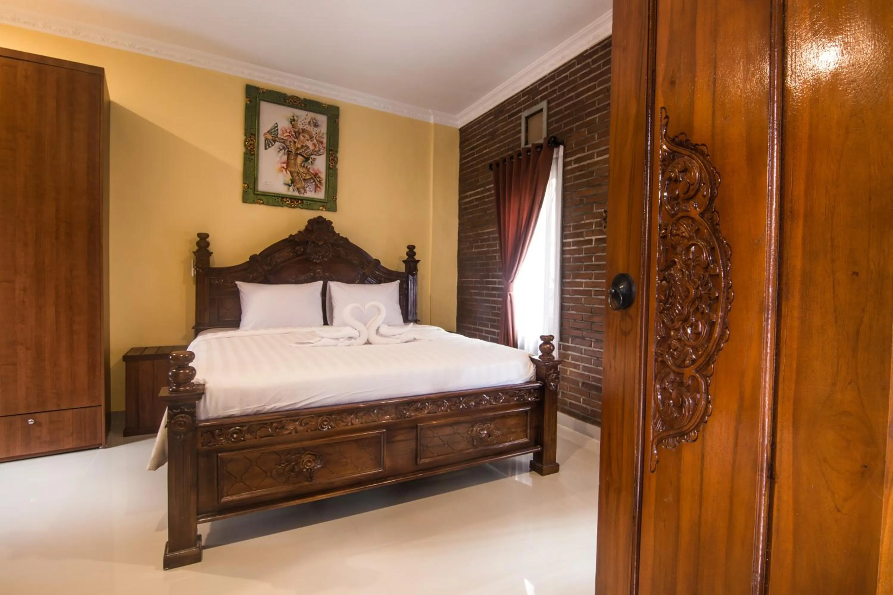Bed in The Garuda Homestay Sanur