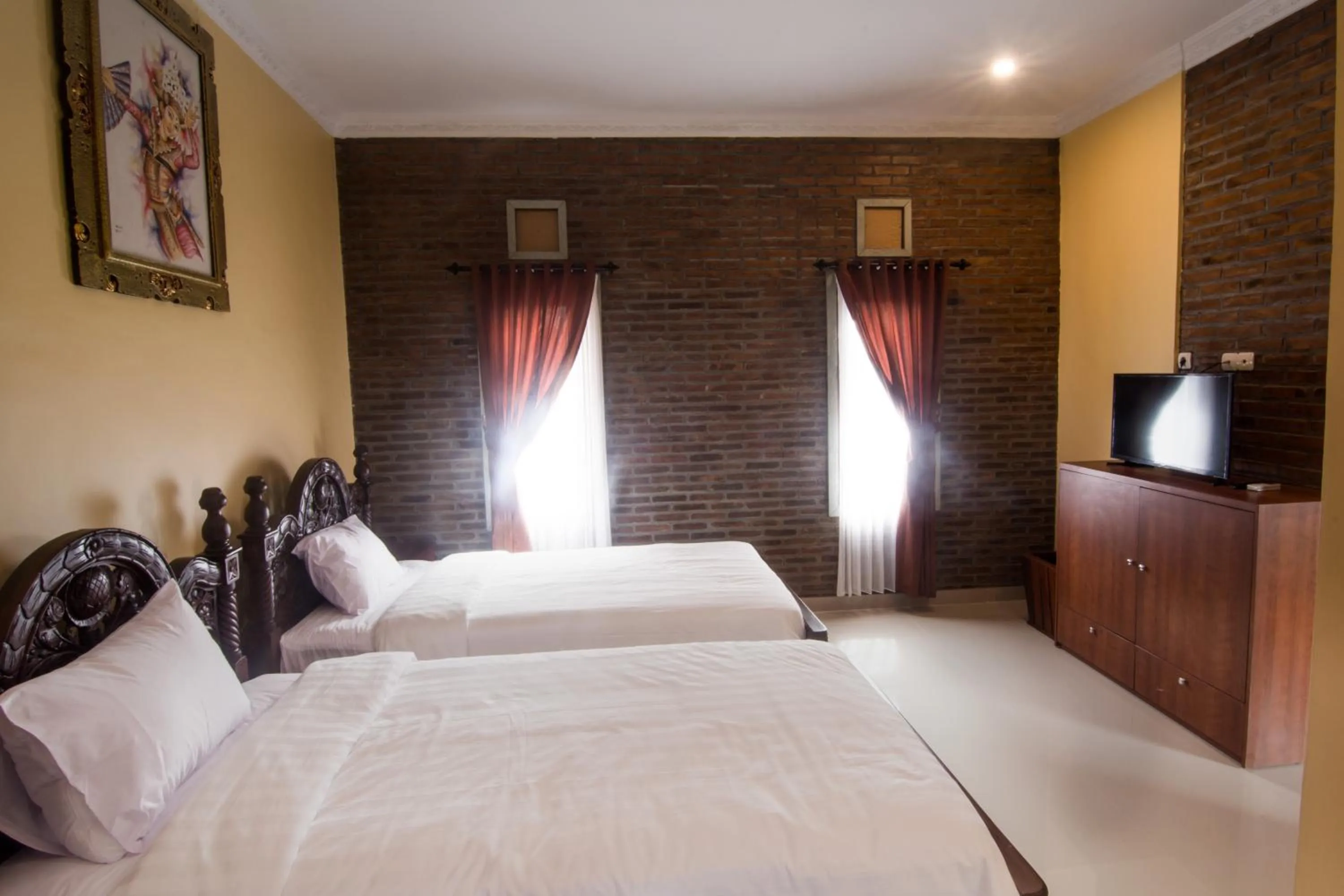 Bed in The Garuda Homestay Sanur