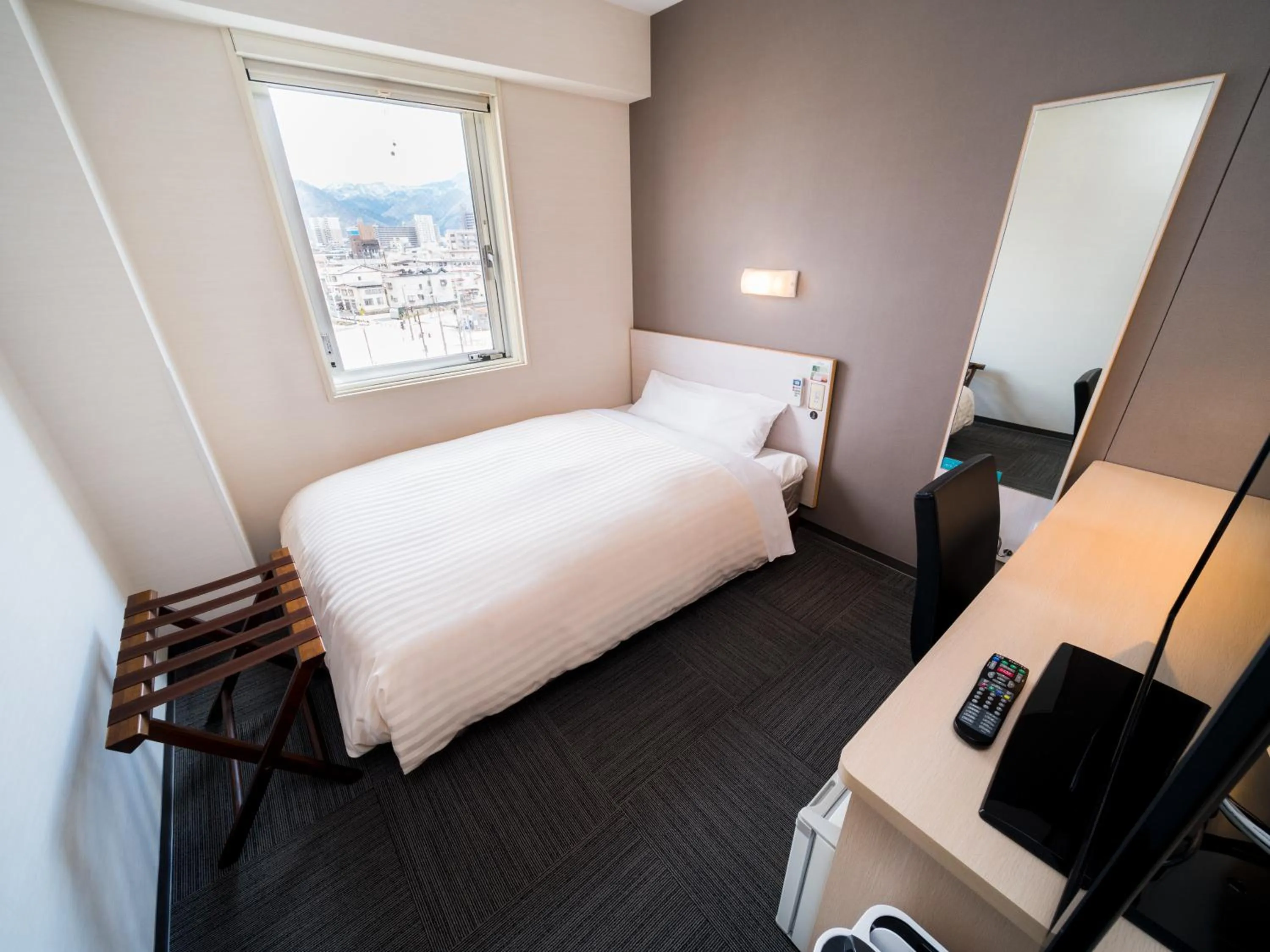 Bed in Super Hotel Yamagataeki Nishiguchi Hot Spring