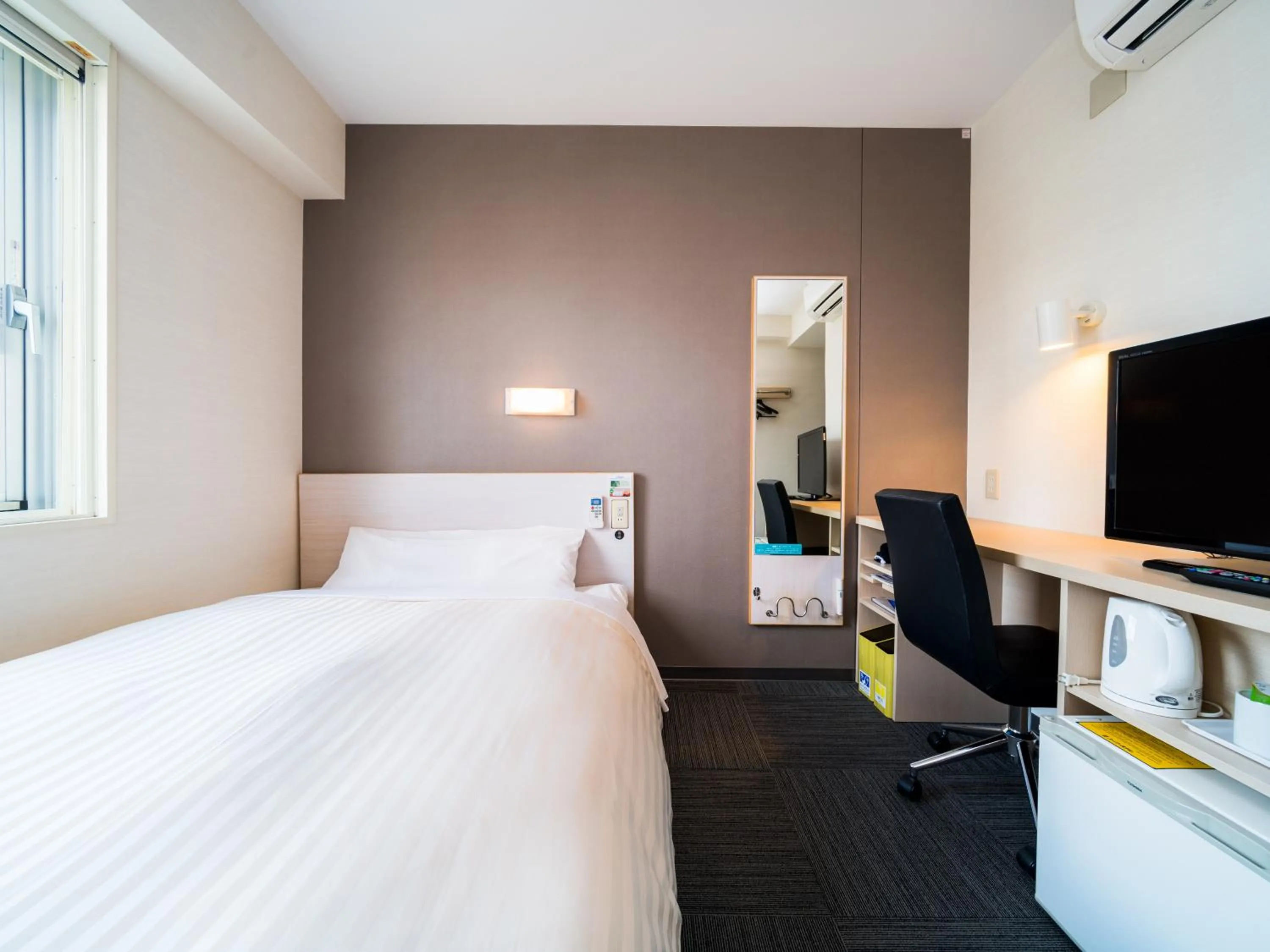 Bed in Super Hotel Yamagataeki Nishiguchi Hot Spring