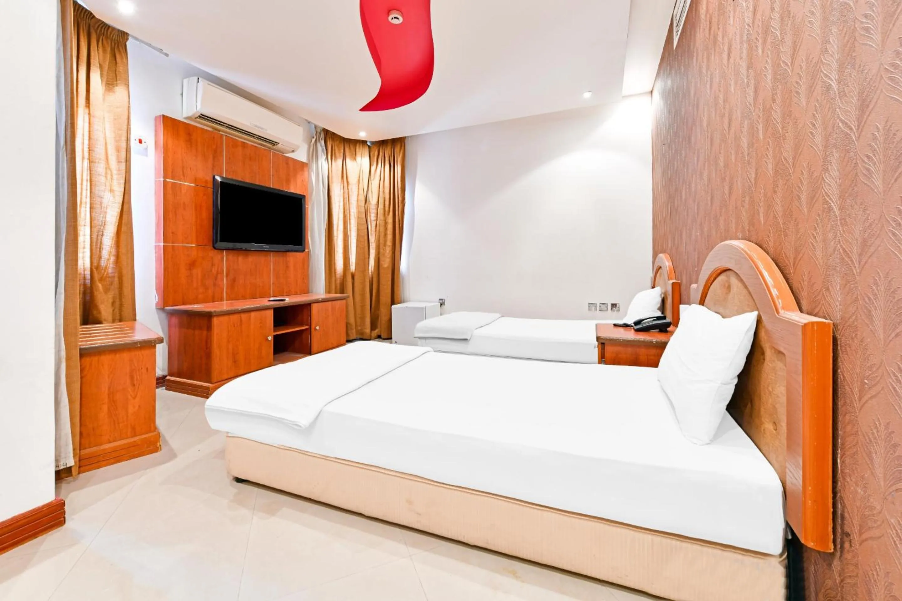 Bedroom, Bed in OYO 118 Revira Hotel