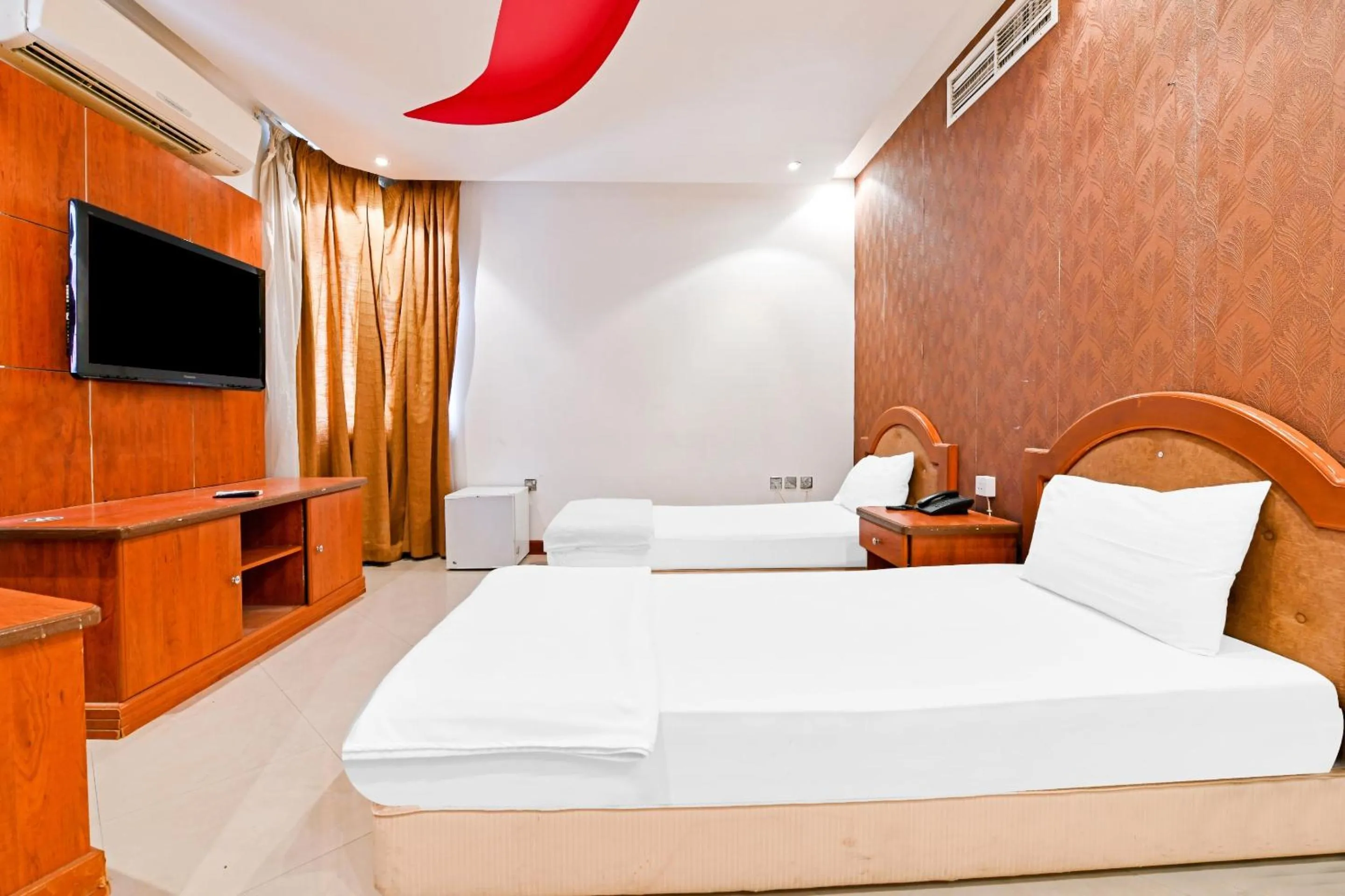 Bedroom, Bed in OYO 118 Revira Hotel