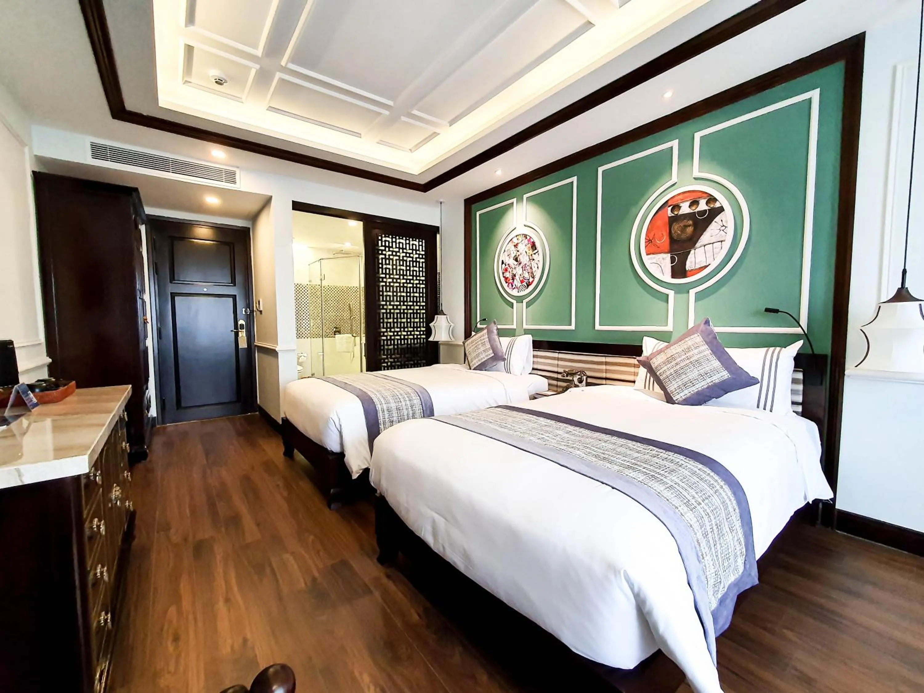 Bed in Le Pavillon Hoi An Gallery Hotel & Spa