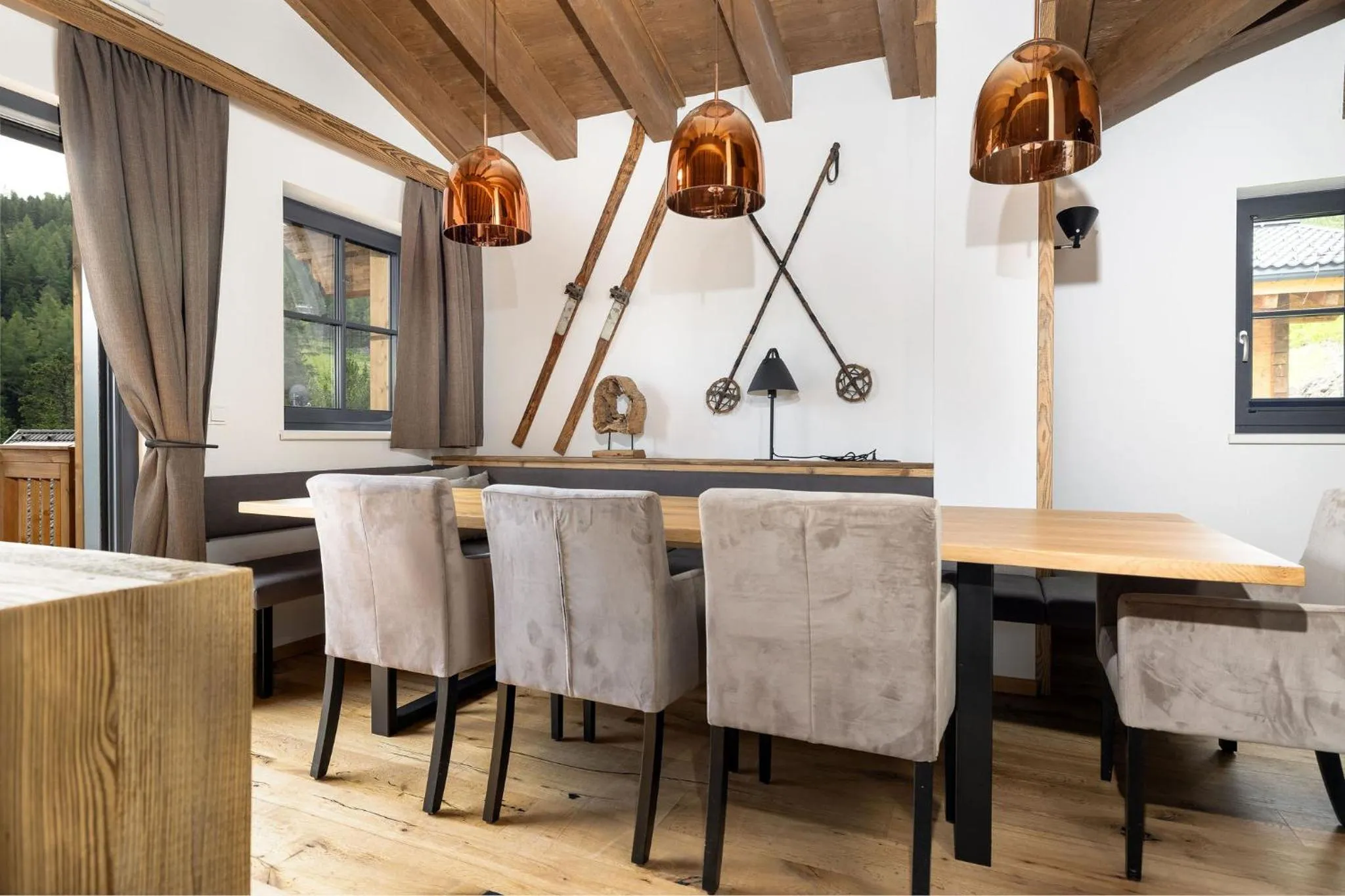 Dining area in Turrach Lodges by ALPS RESORTS