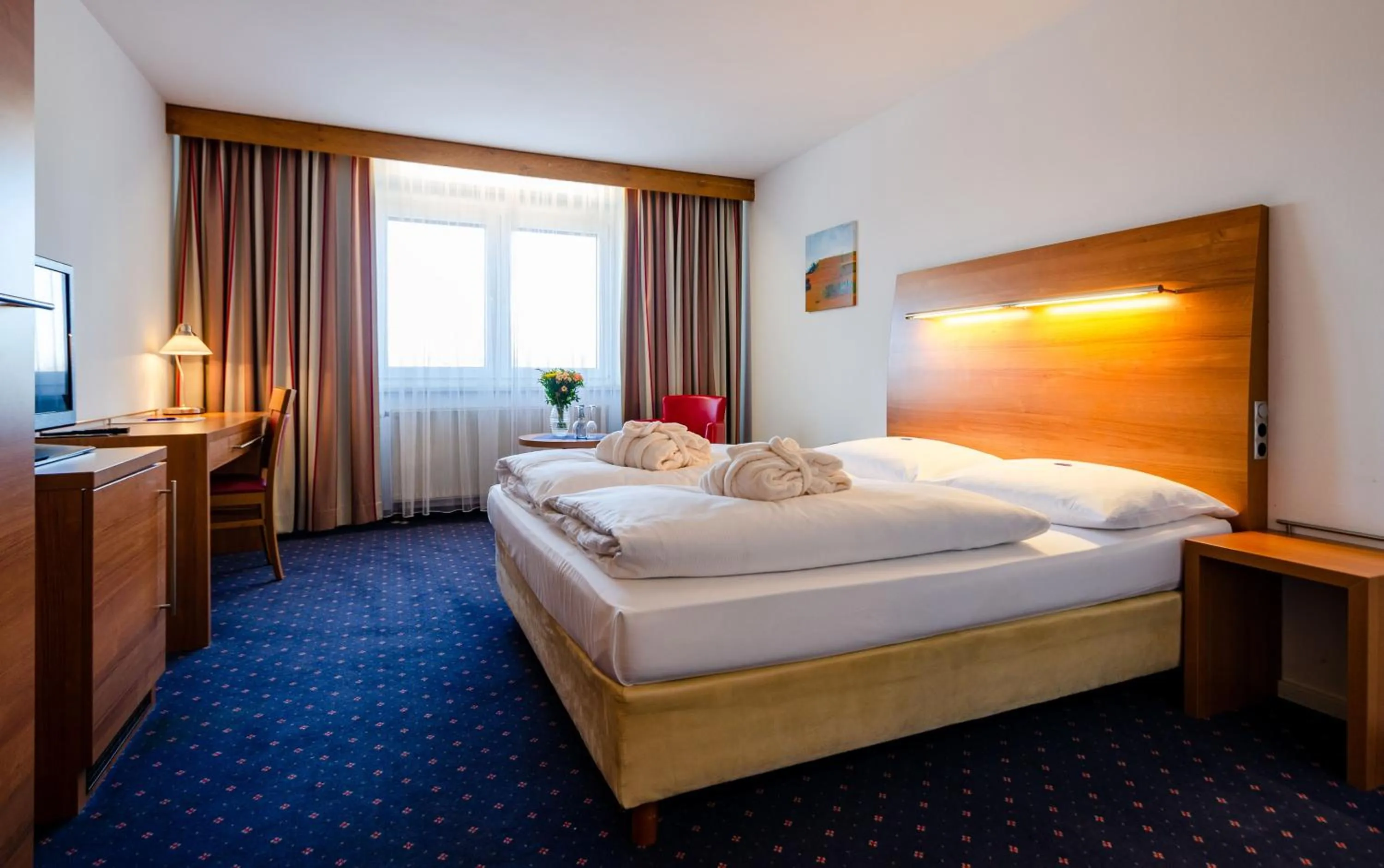 Photo of the whole room, Bed in Hotel Fortuna Reutlingen-Tübingen