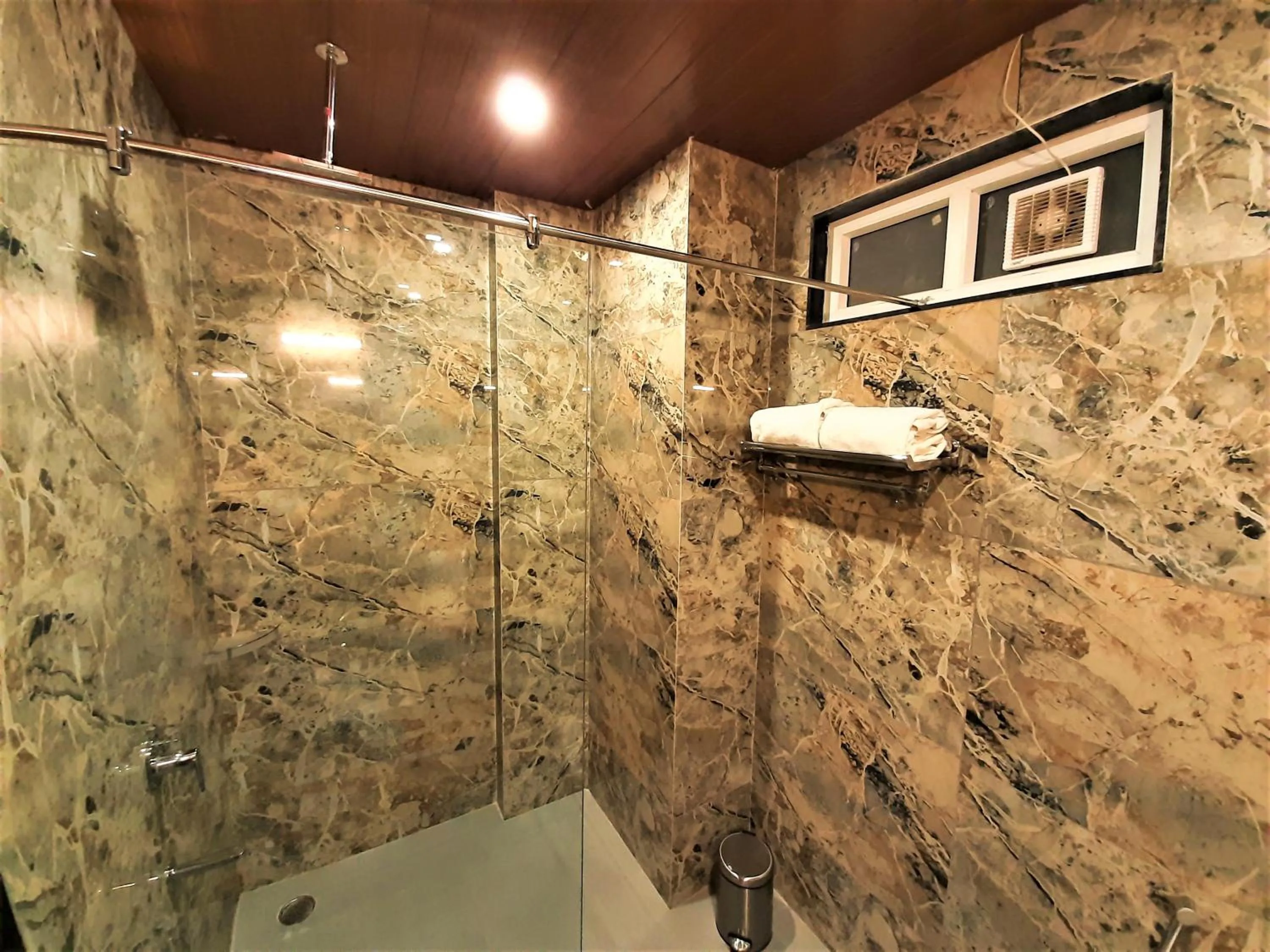 Shower in Suvin Residency with Rooftop Swimming Pool